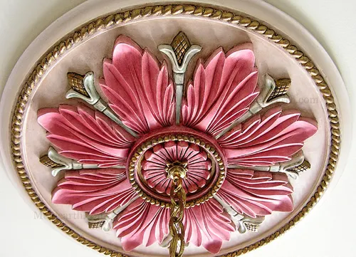 pink and green painted medallion