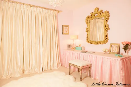 baby nursery with pink fabric vanity dressing table