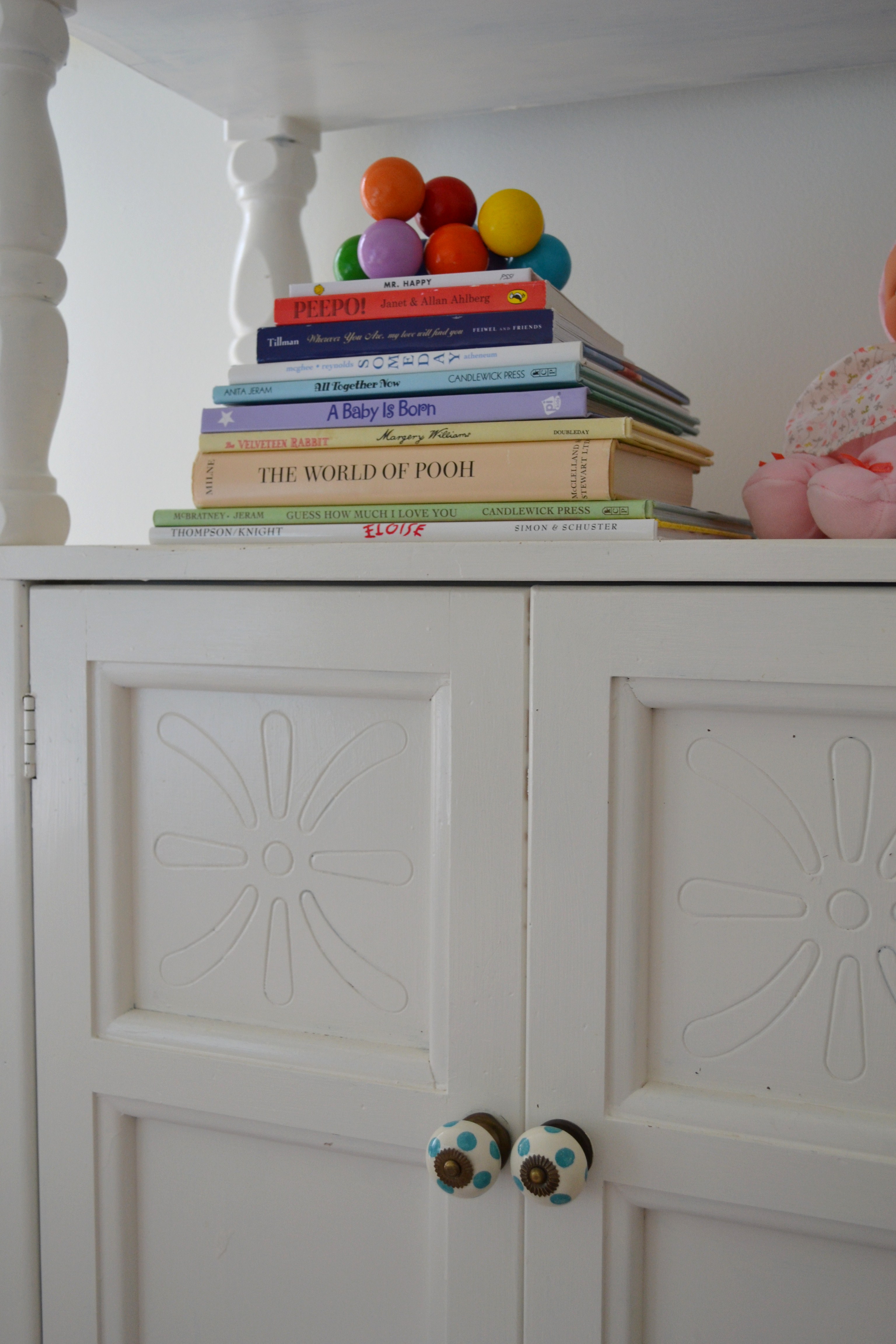 Girl Colorful Nursery Books on a Dresser