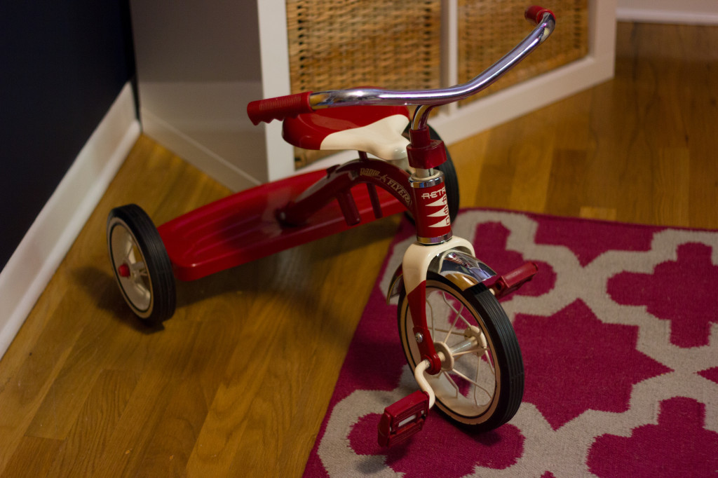 Cozy and Colorful Girl Nursery Red Tricycle