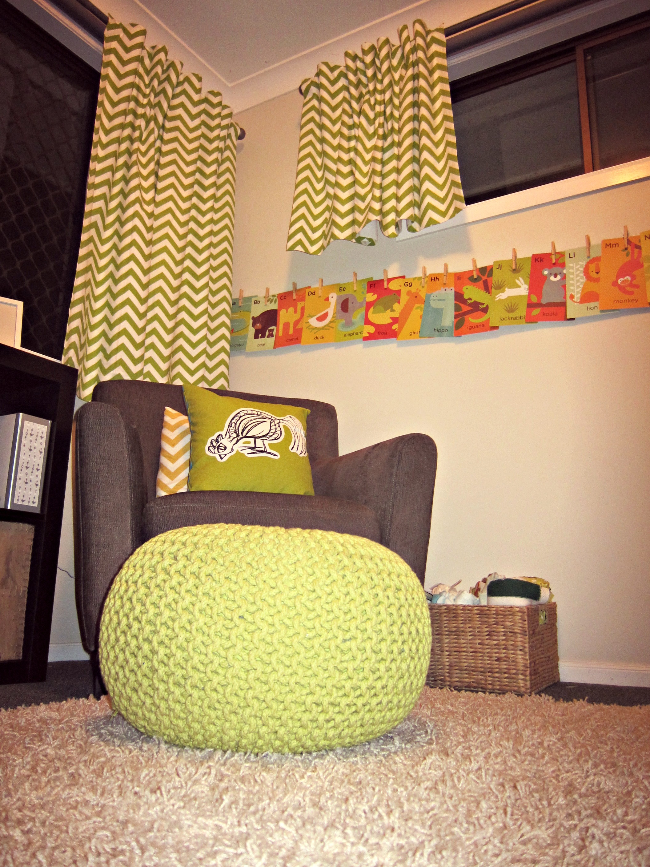 Boy Neutral Nursery With Lime Green Pouf and Curtains