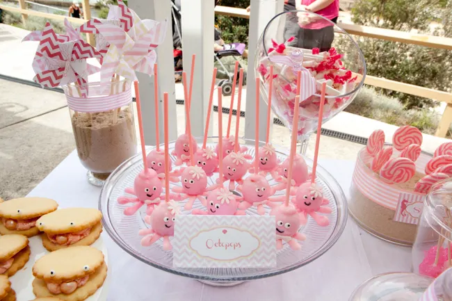 Seaside Birthday party pink octopus cake pops on dessert table