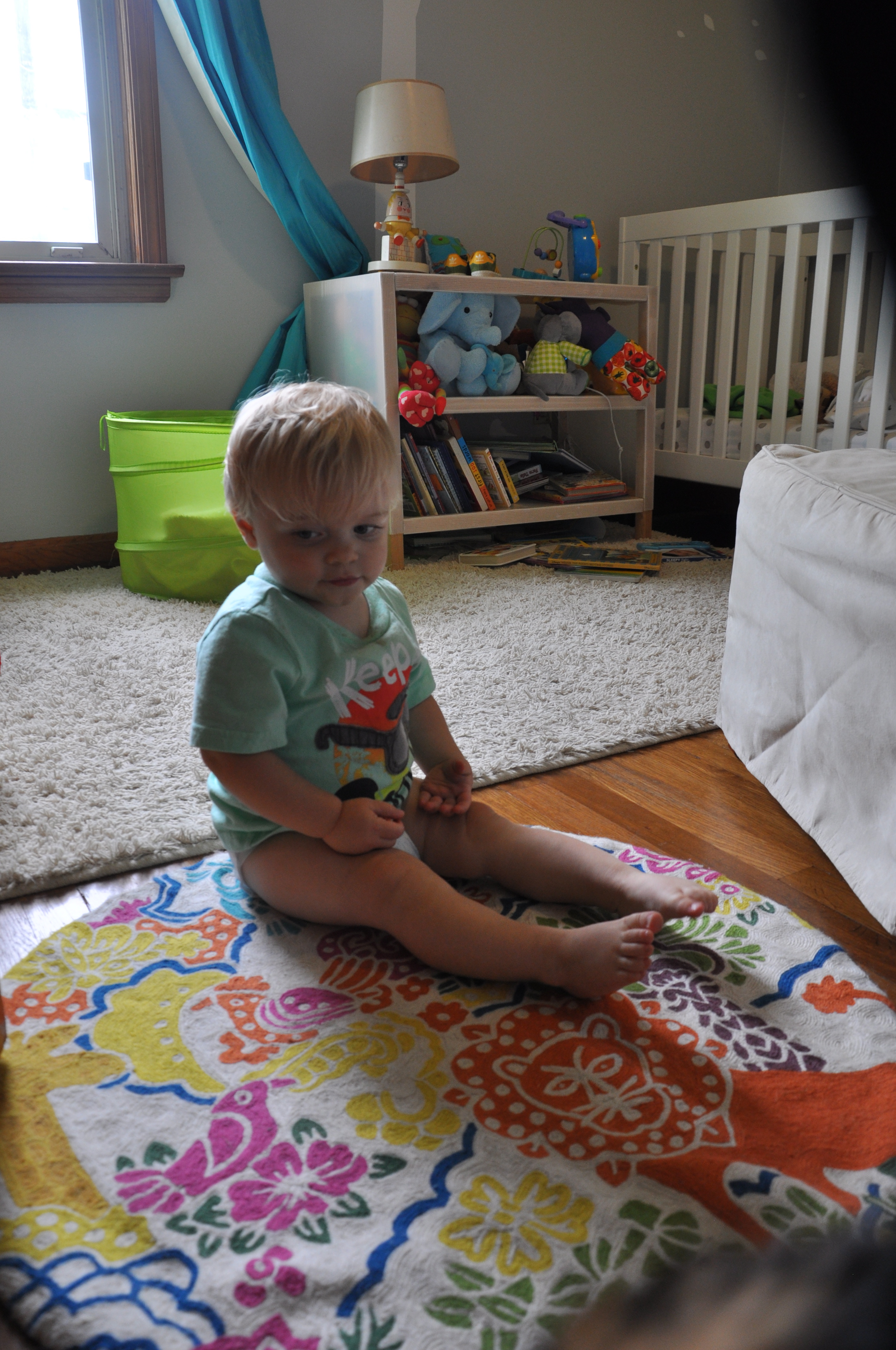 Gender-Neutral Nursery Boy on a Carpet