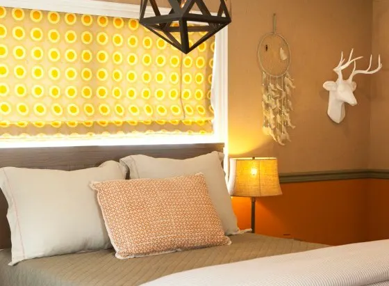 Orange and Brown Hunting-Inspired Bedroom with Mounted Deer Head - Project Nursery