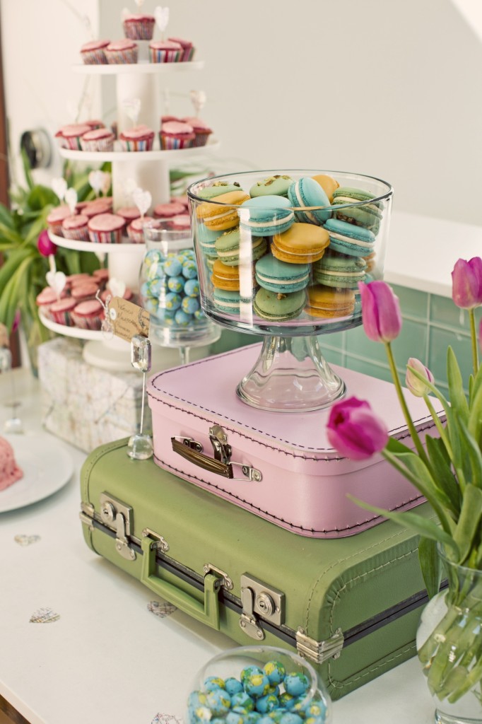 Stacked Suitcases and Colorful Macaroons