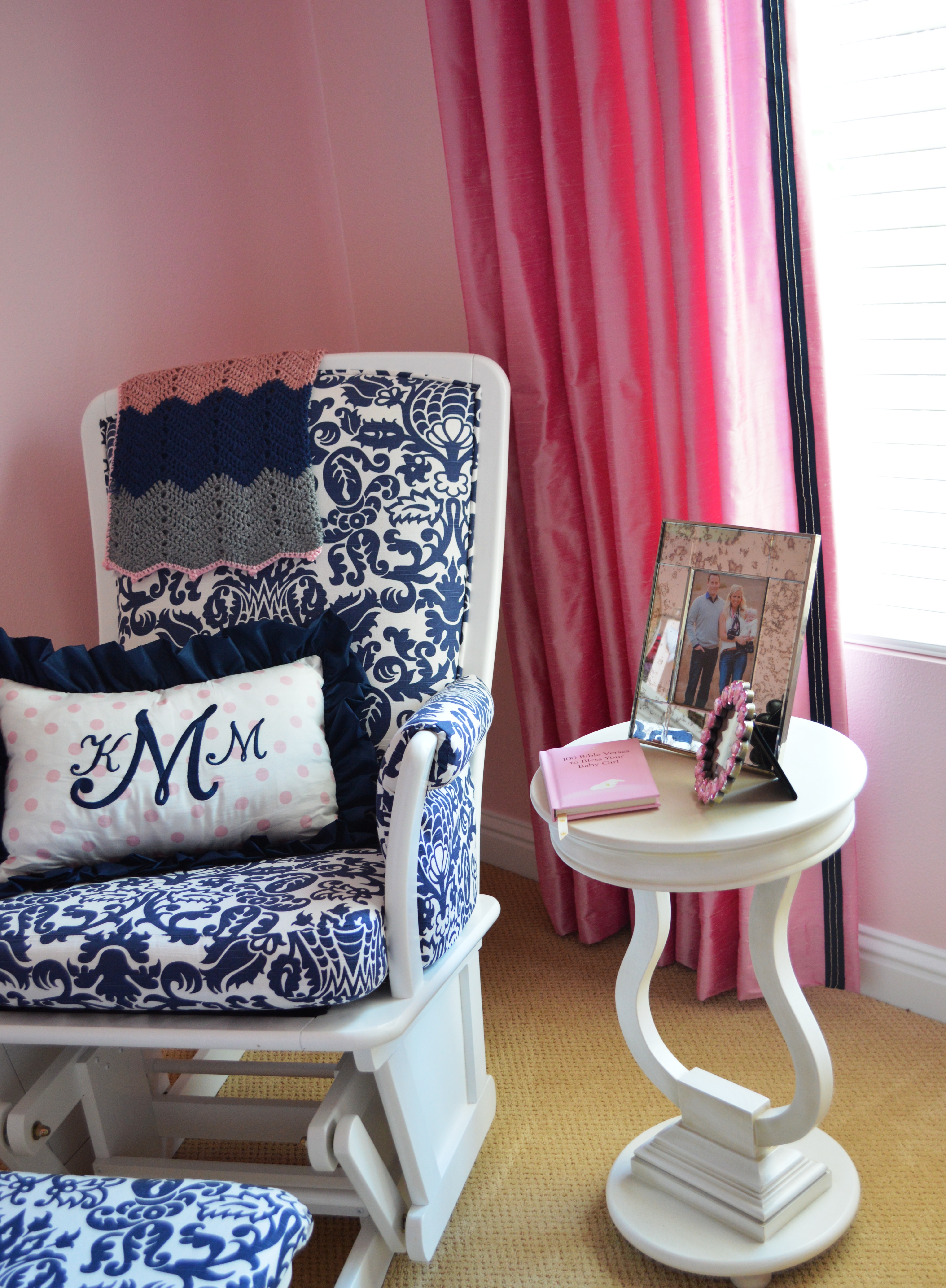 White Glider with Navy and White Floral Cushions