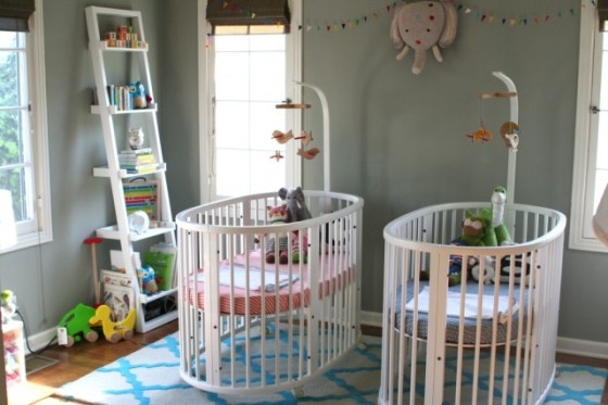 twin bed and crib in small room