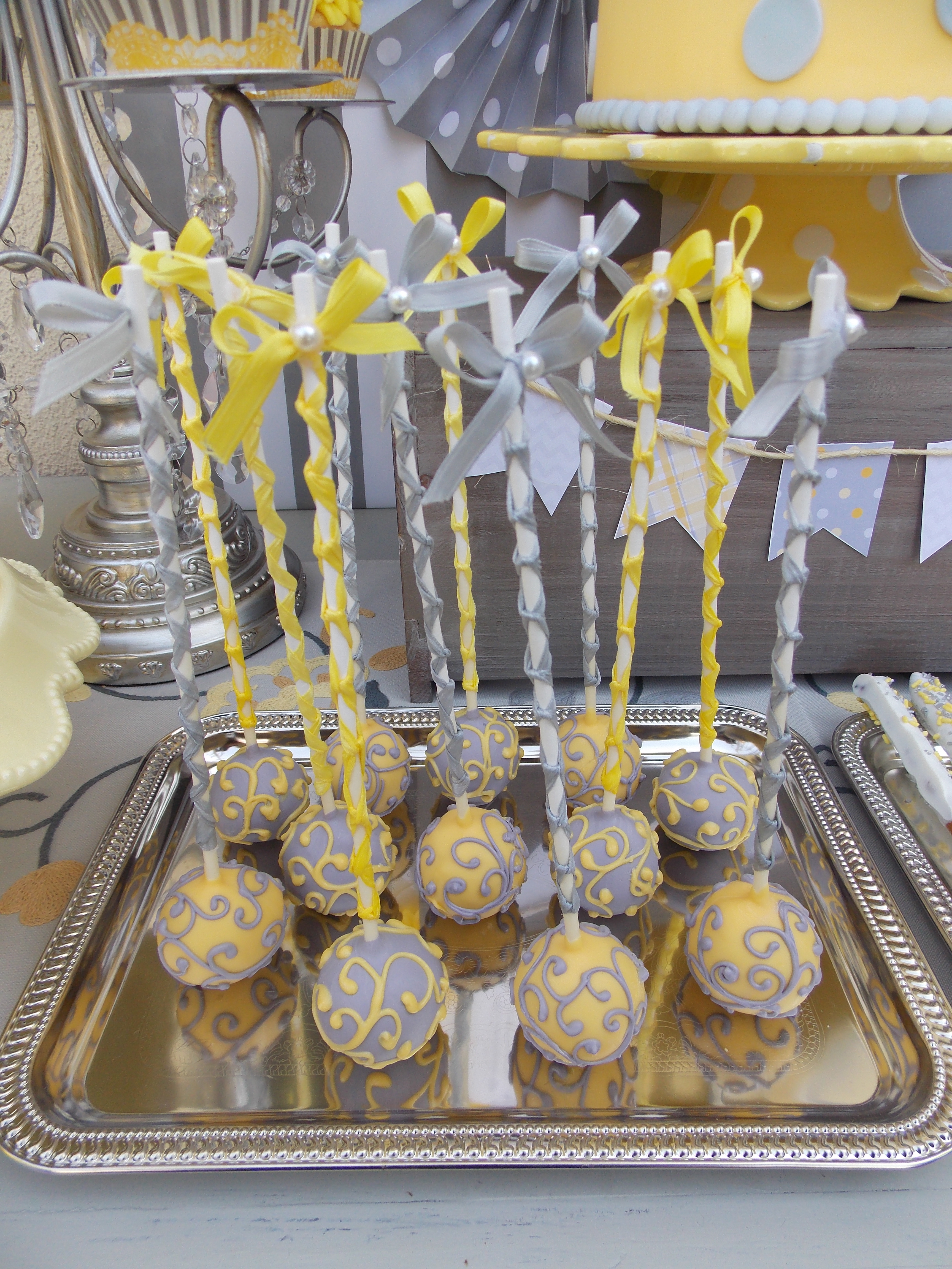 Gray and Yellow Scroll Cake Pops
