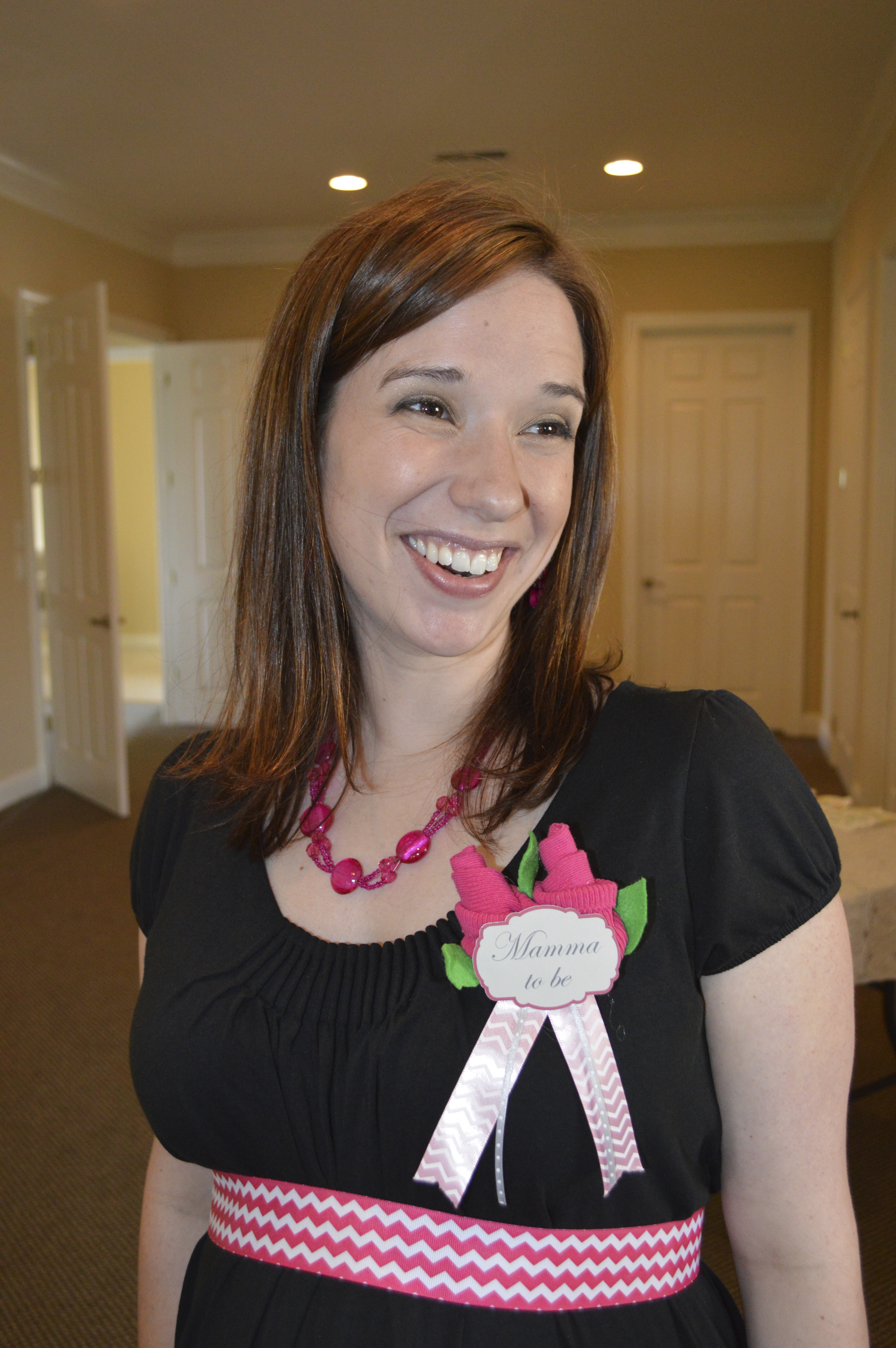 Mommy-to-be" Corsage is Baby Socks Rolled into Roses