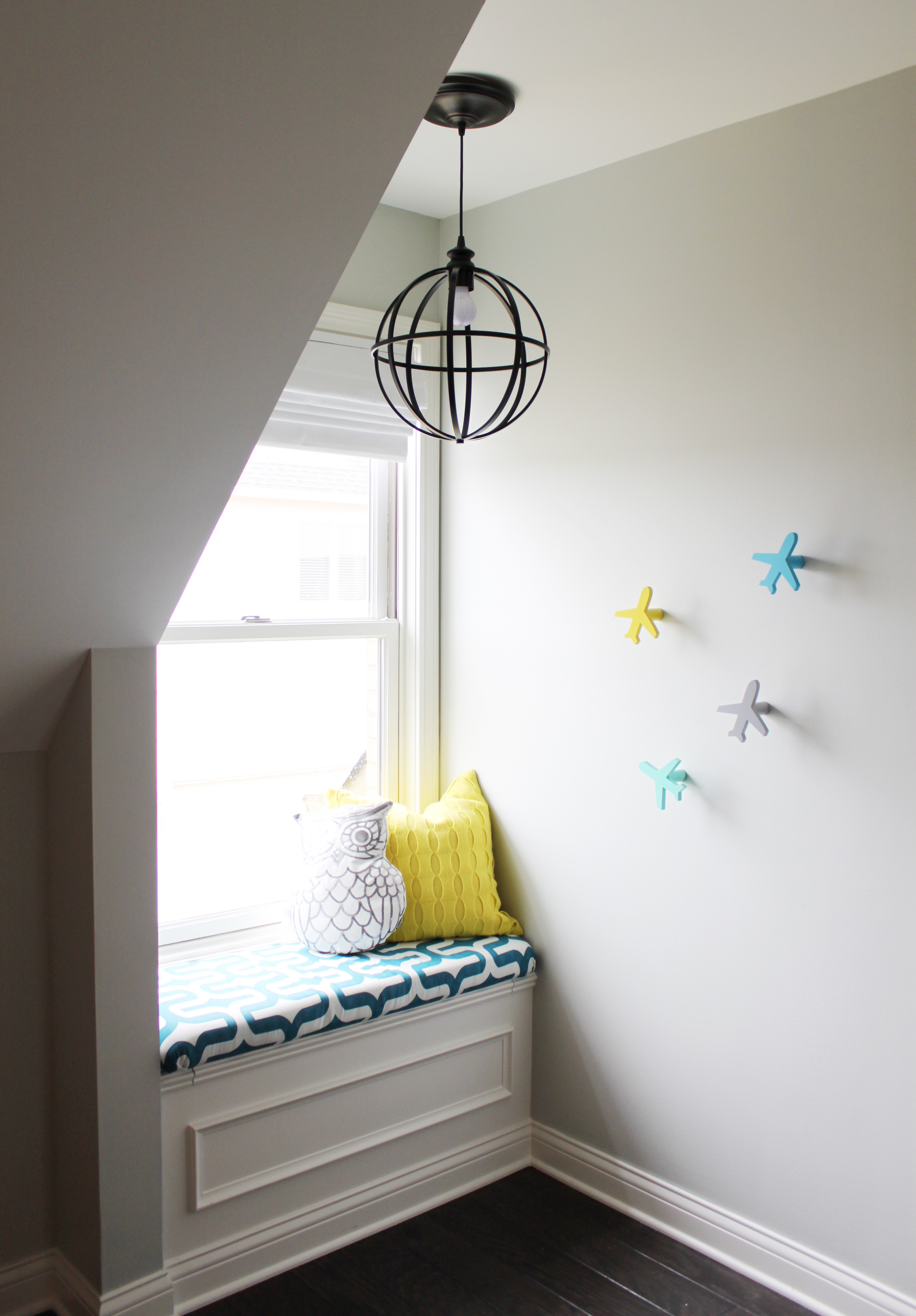 Cozy Nook and Window Seat in this Modern Nursery