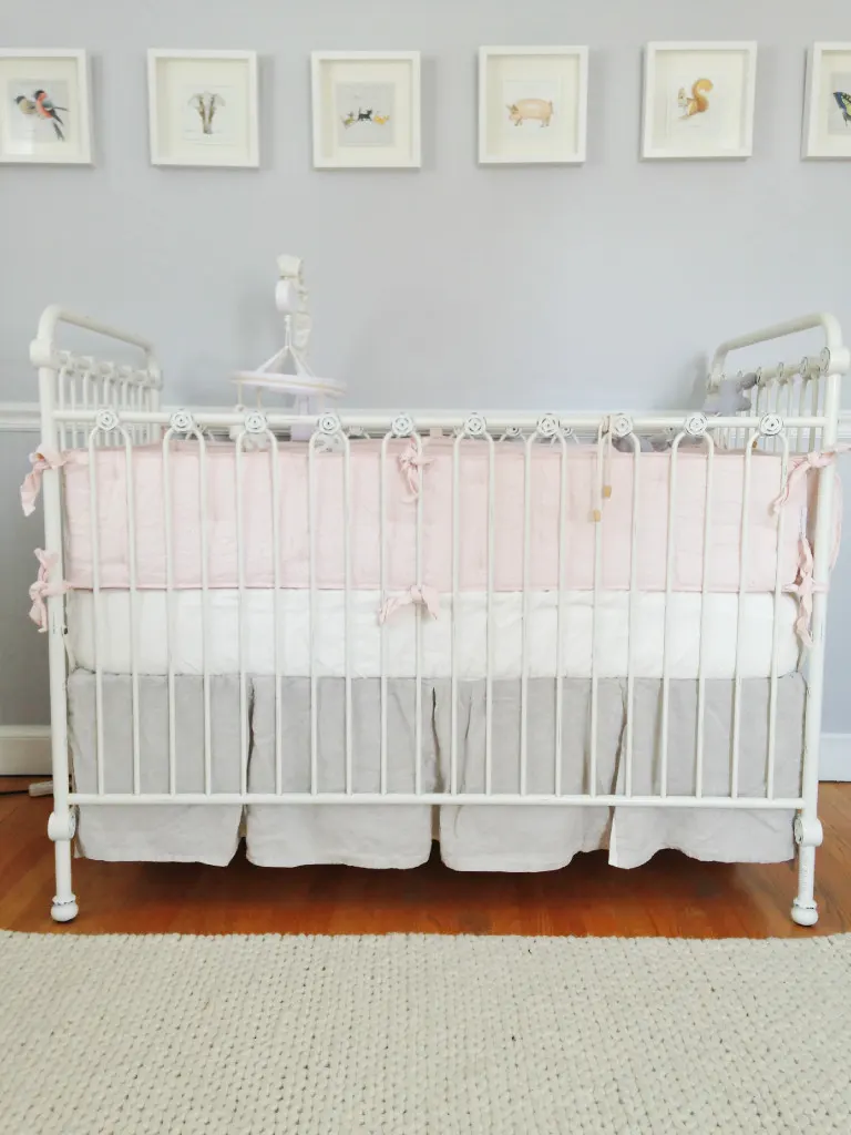 White Crib with Pink and Gray Bedding - Project Nursery