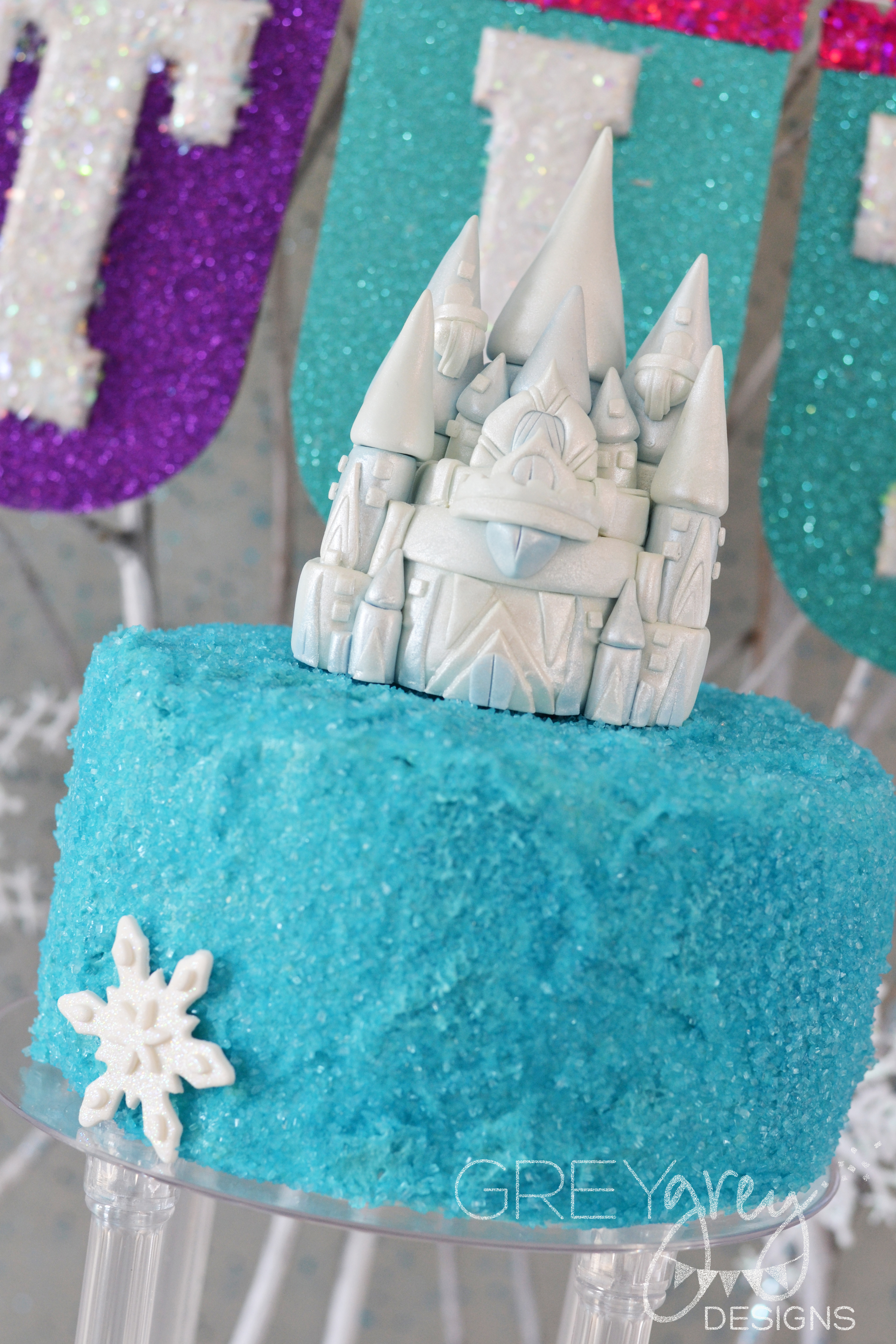 Disney Frozen Cake with Turquoise Frosting and Blue Sparkly Sugar