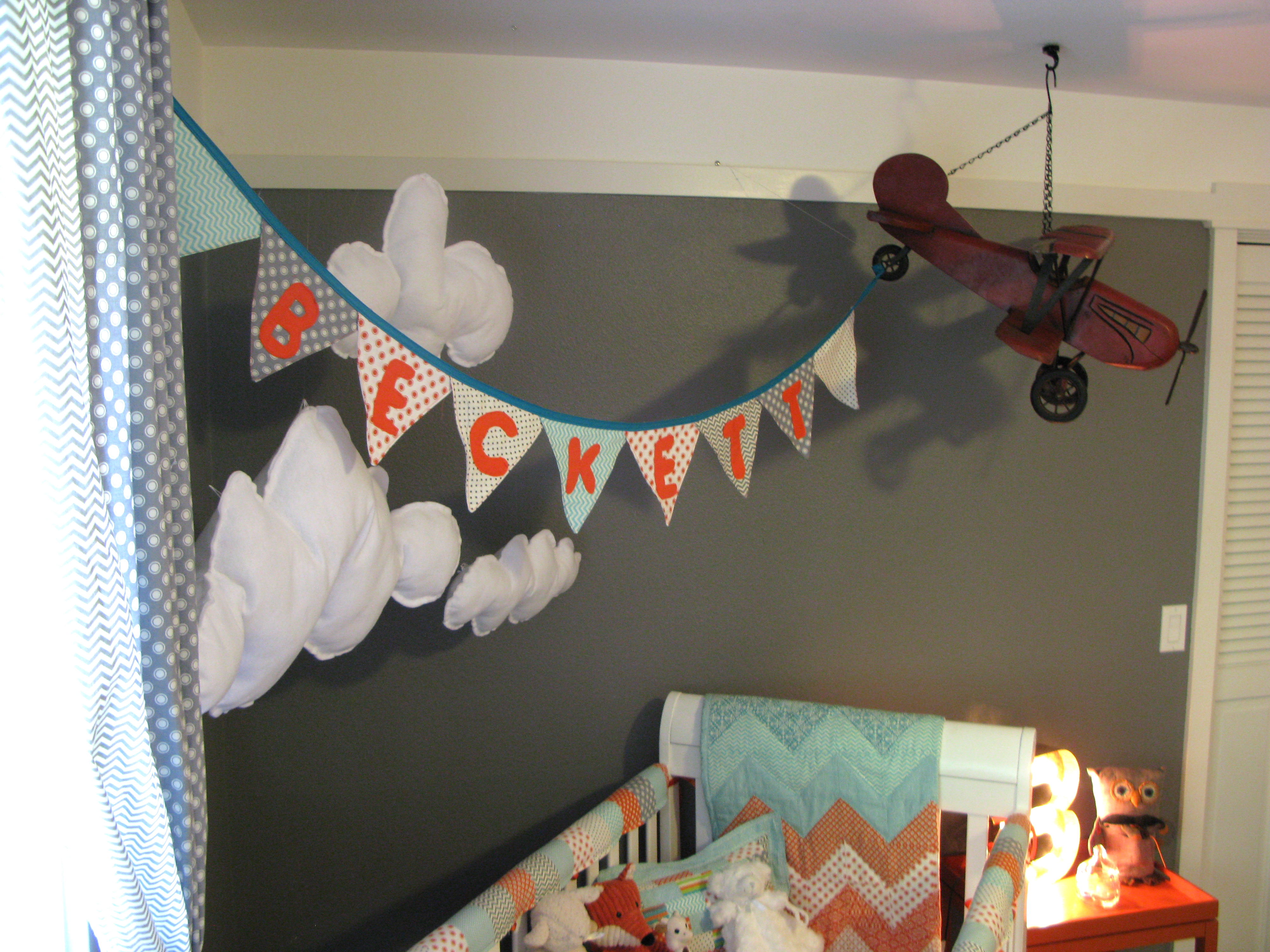 Personalized Banner With Clouds and Airplane Over Crib