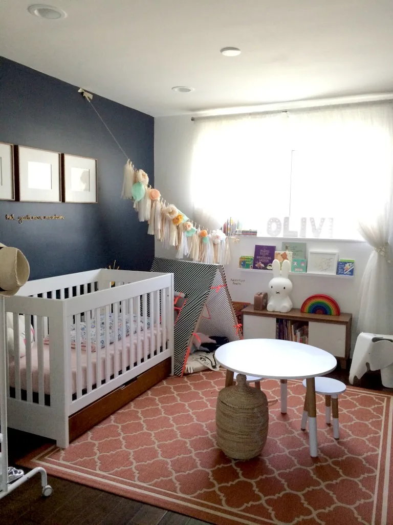 Whimsical Nursery with Navy Accent Wall - Project Nursery