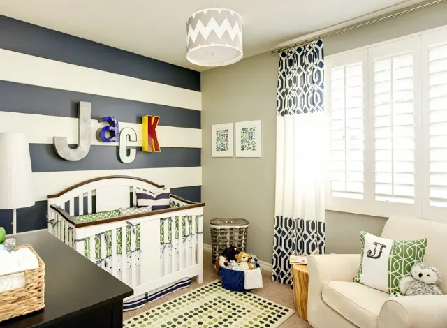 Whimsical Nursery with Navy Striped Accent Wall - Project Nursery