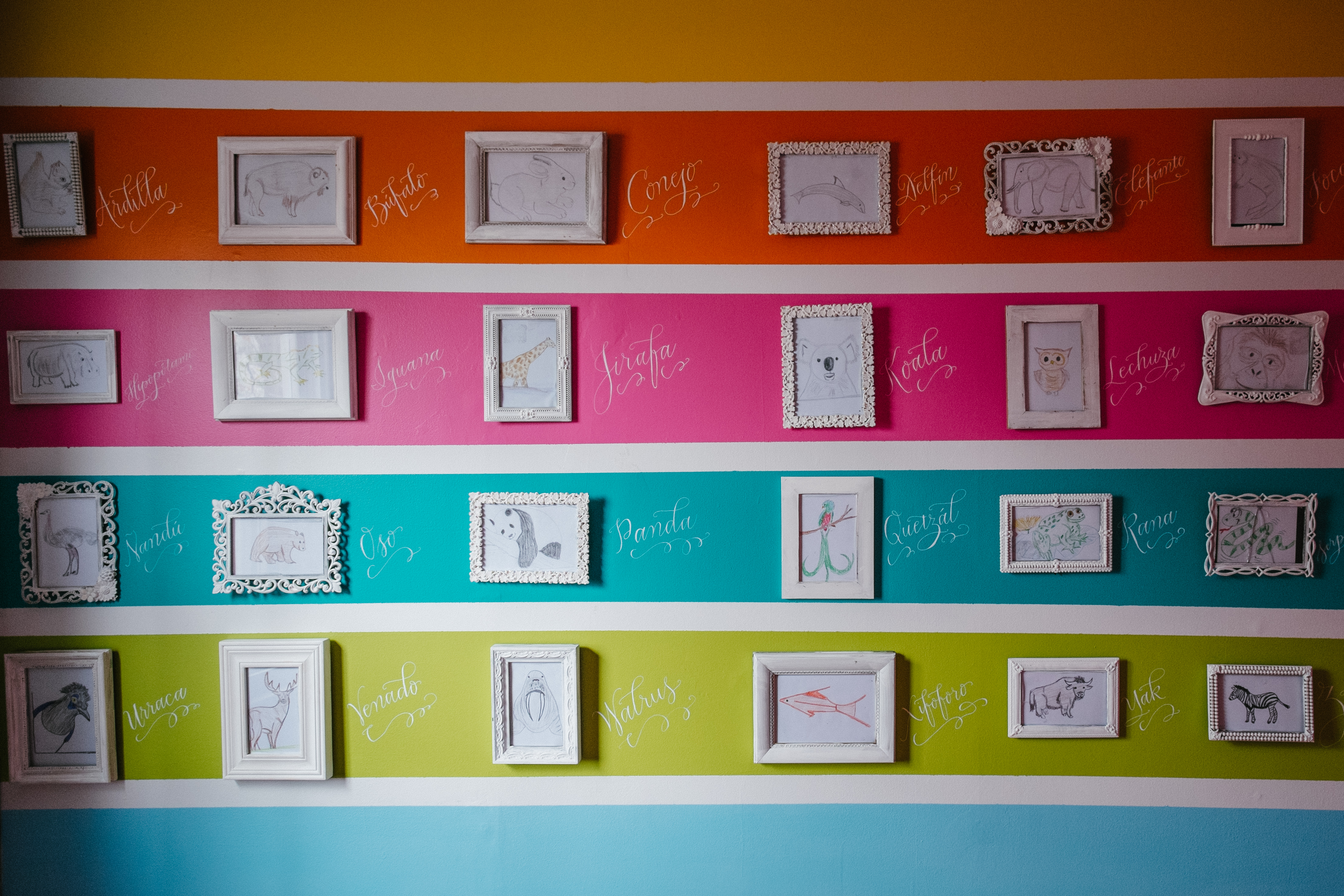 Rainbow Striped Nursery Wall with Animal Lettering and Words in Frames