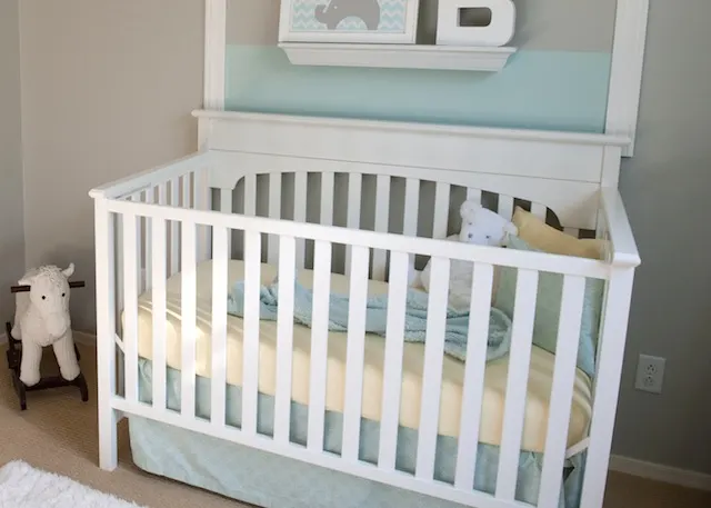 White Crib with Yellow and Blue Bedding