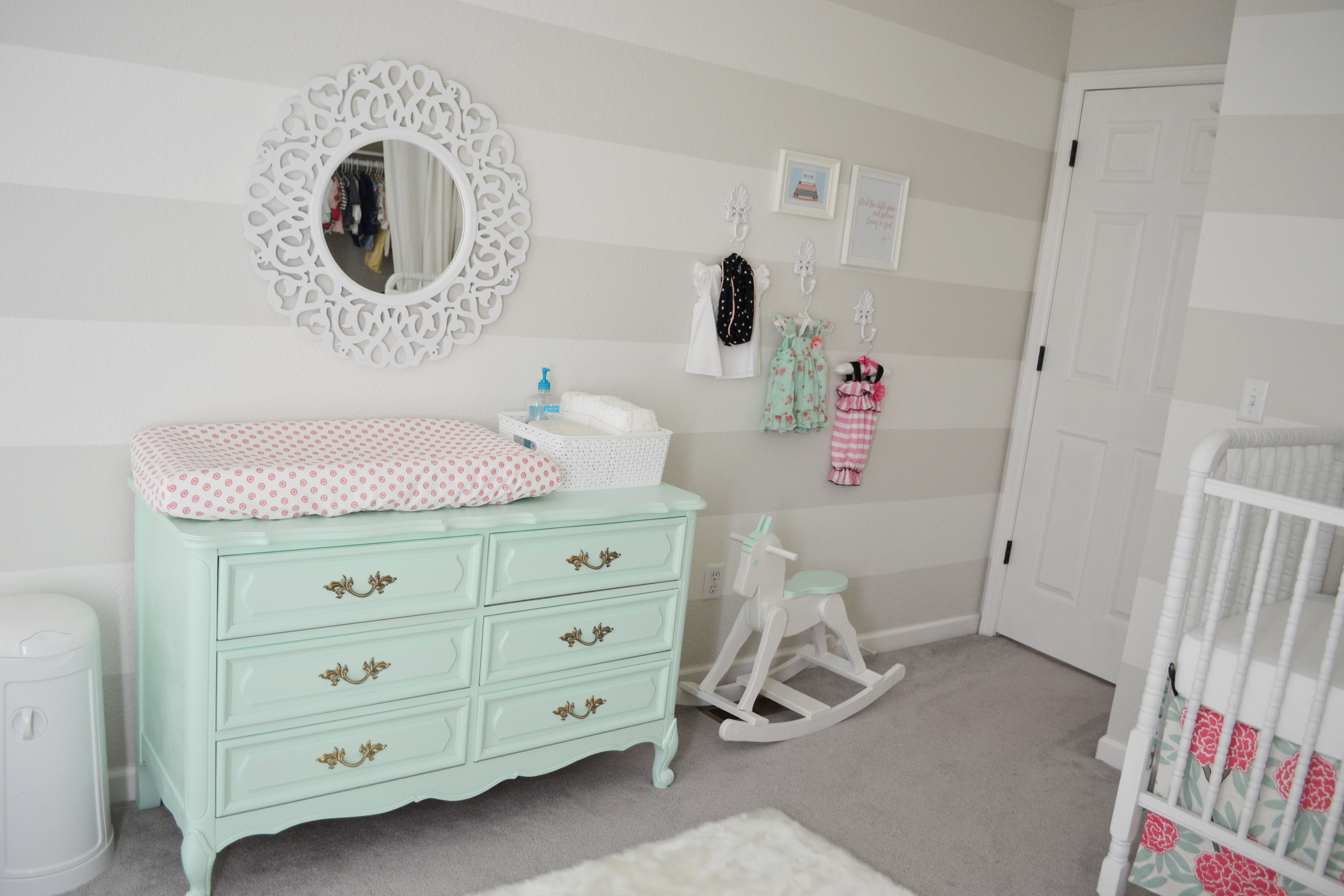 Gray and White Striped Accent Wall in this Mint, Pink and Coral Nursery