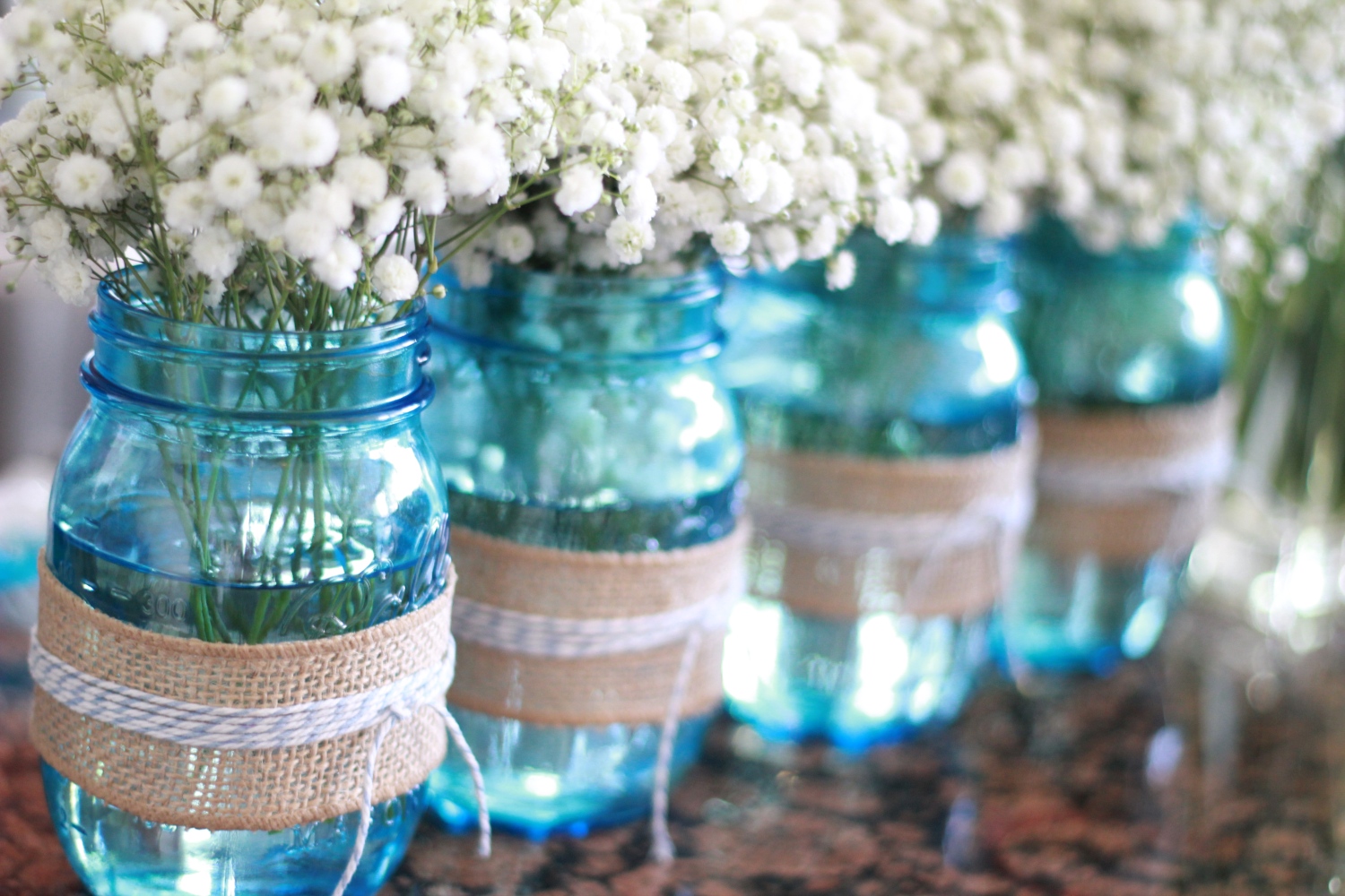 Blue Mason Jars Wrapped in Burlap and String with Baby's Breath Flowers
