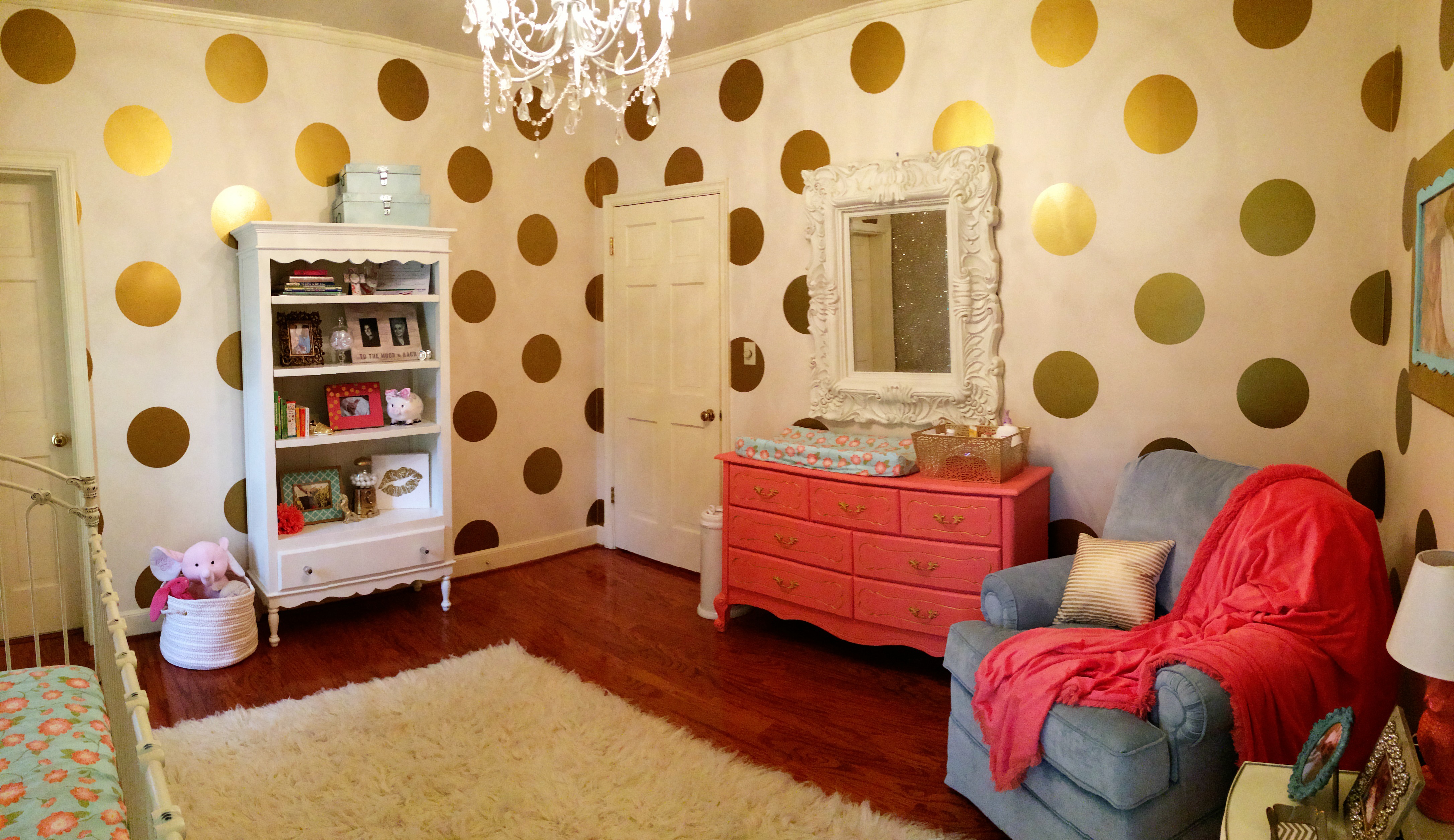 Gold Polka Dot Walls in this Coral and Gold Nursery