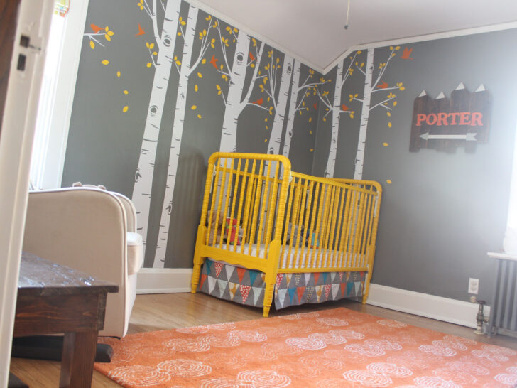 Painted Yellow Crib in this Woodland Theme Nursery