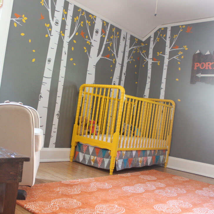 Painted Yellow Crib in this Woodland Theme Nursery