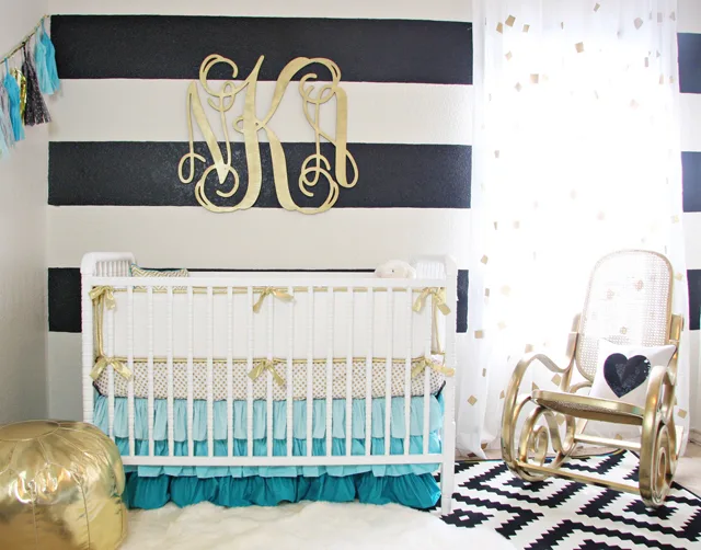 White crib with gold sales accents