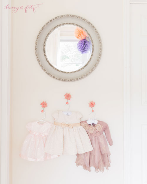 Display Pretty or Sentimental Clothes in the Nursery as Decor