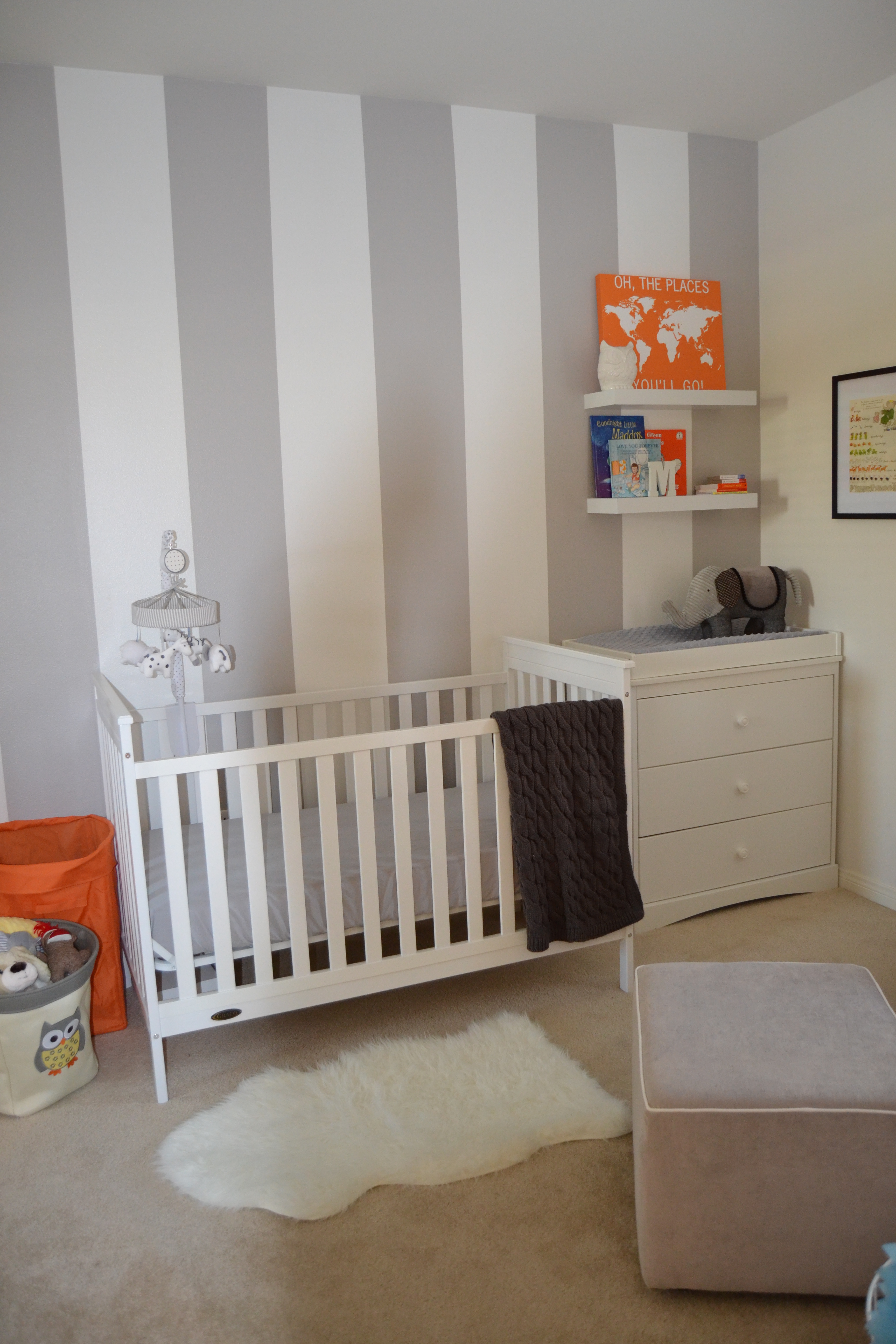 Grey and White Striped Accent Wall in this White and Grey Nursery