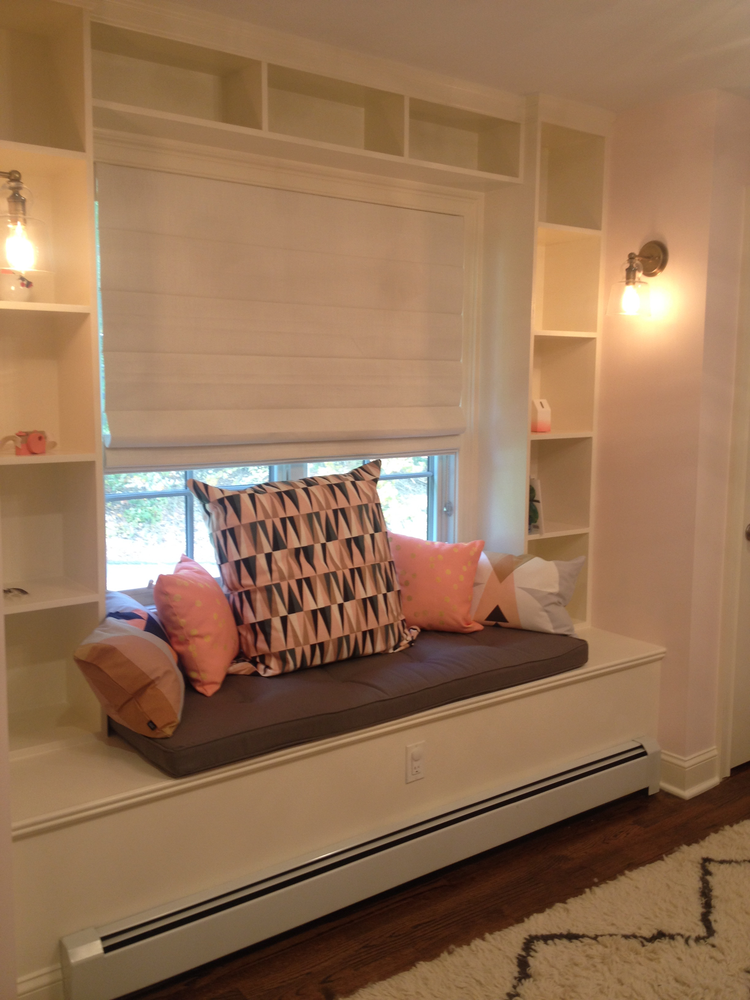 Window Seat in this Coral, Gold and Black Nursery