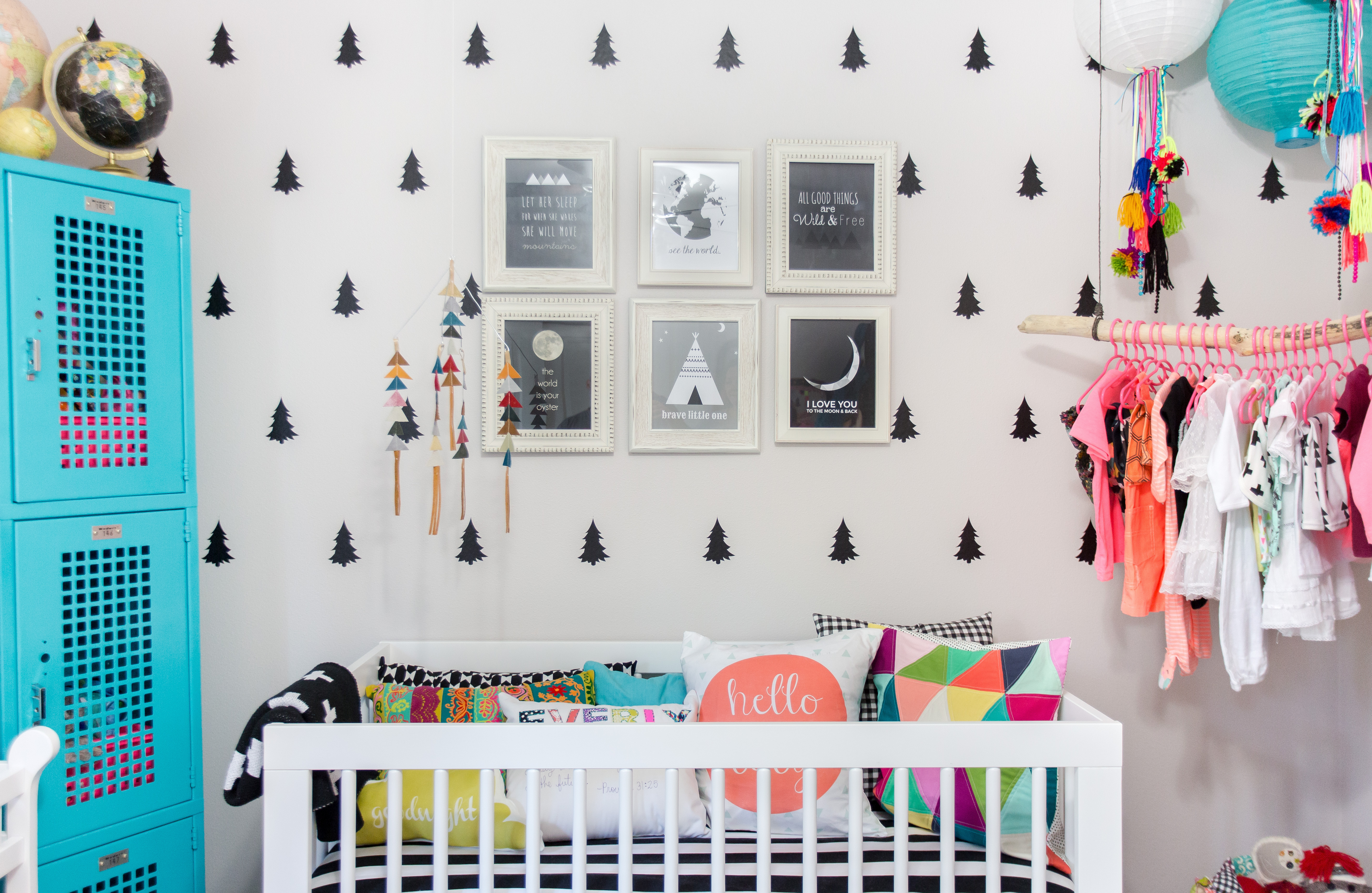 Colorful, Eclectic Boho Nursery with Triangle Decal Accent Wall