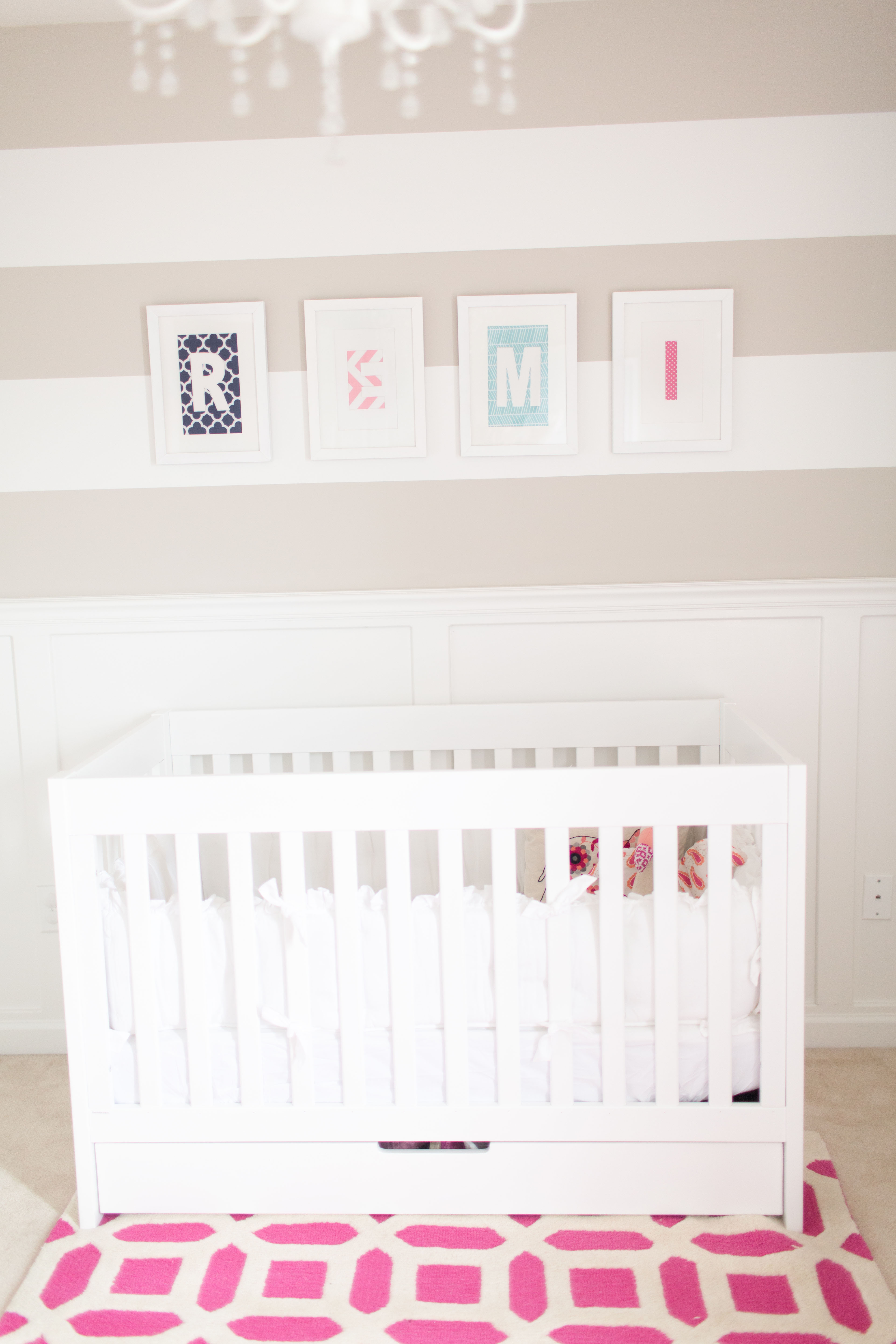 Striped Accent Wall in this Neutral Girly Nursery
