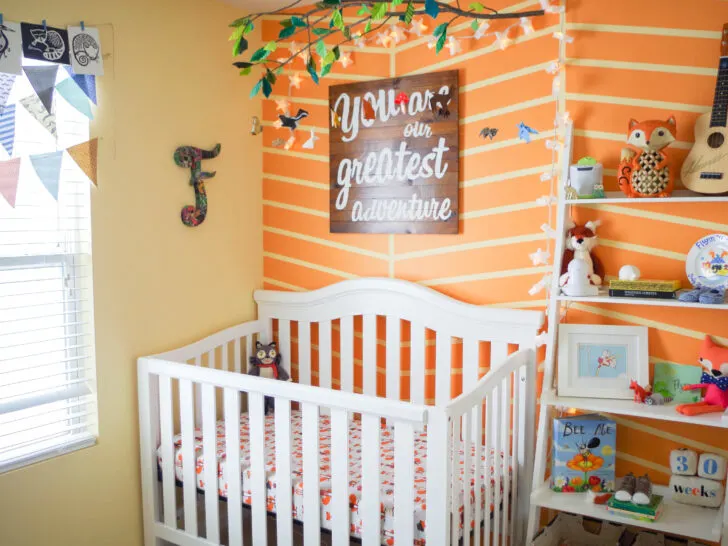 Orange Herringbone Accent Wall in this Colorful Woodland Nursery