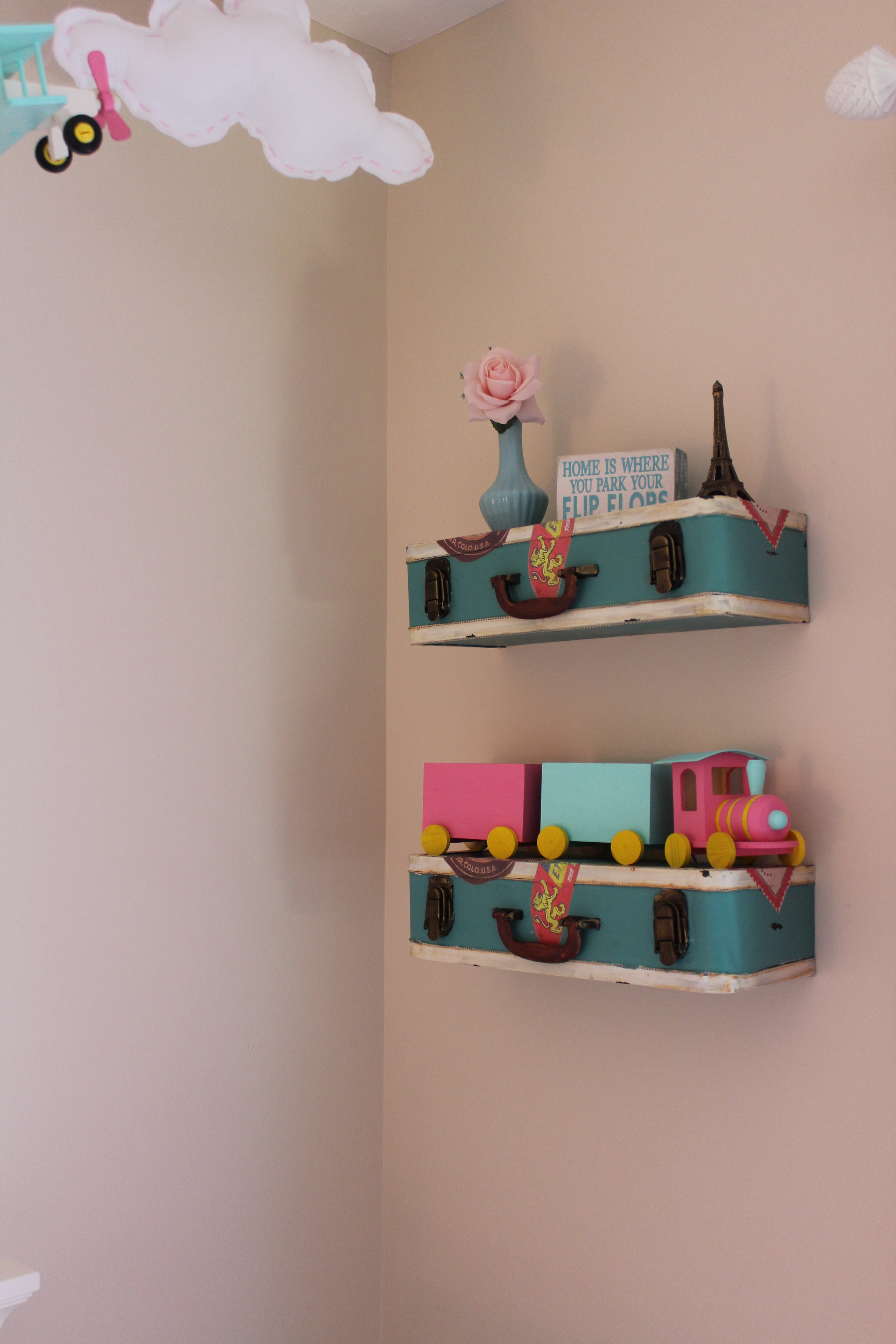 Suitcase Shelves in this Travel Themed Nursery