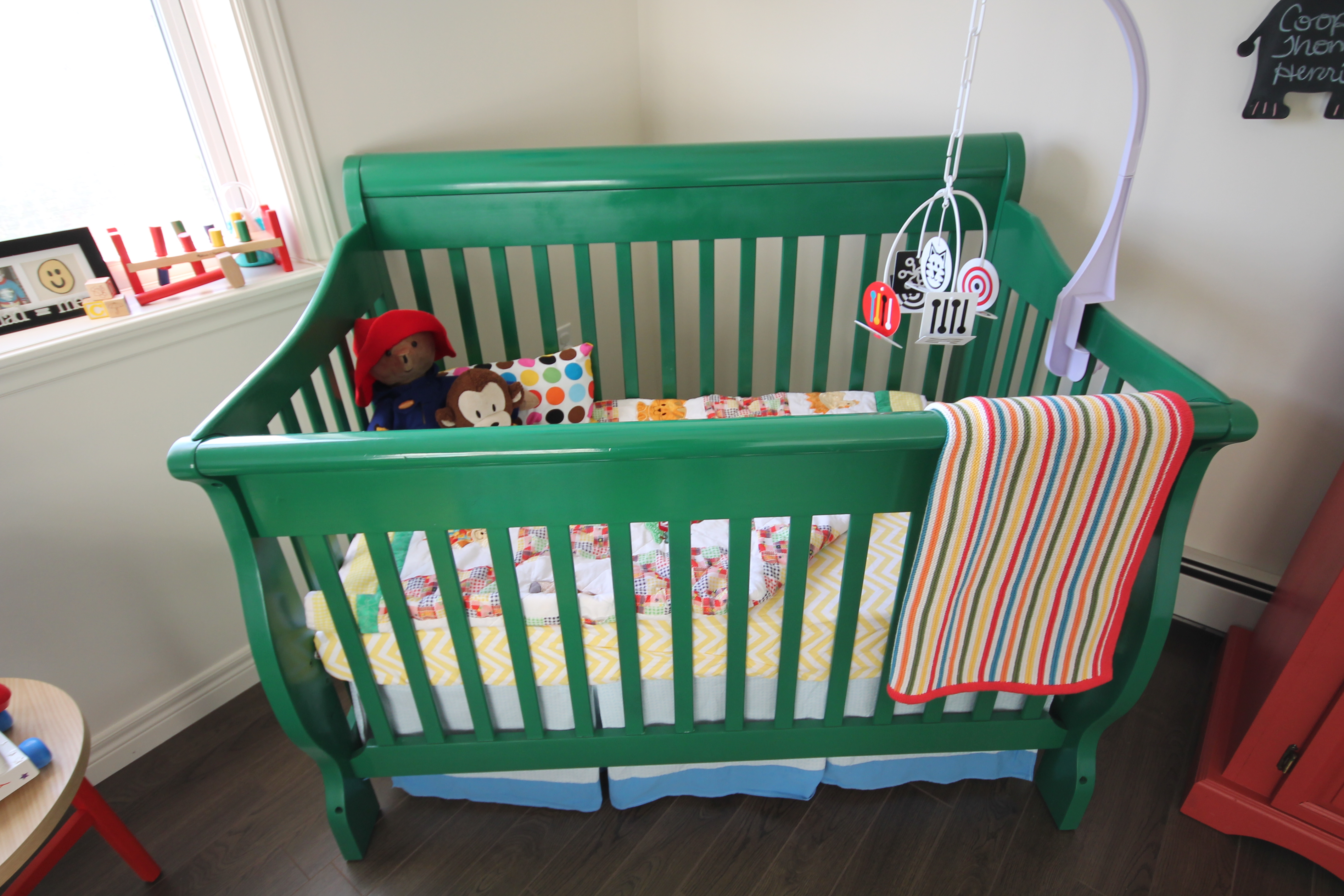 Refinished Kelly Green Crib in this Bright and Colorful Nursery