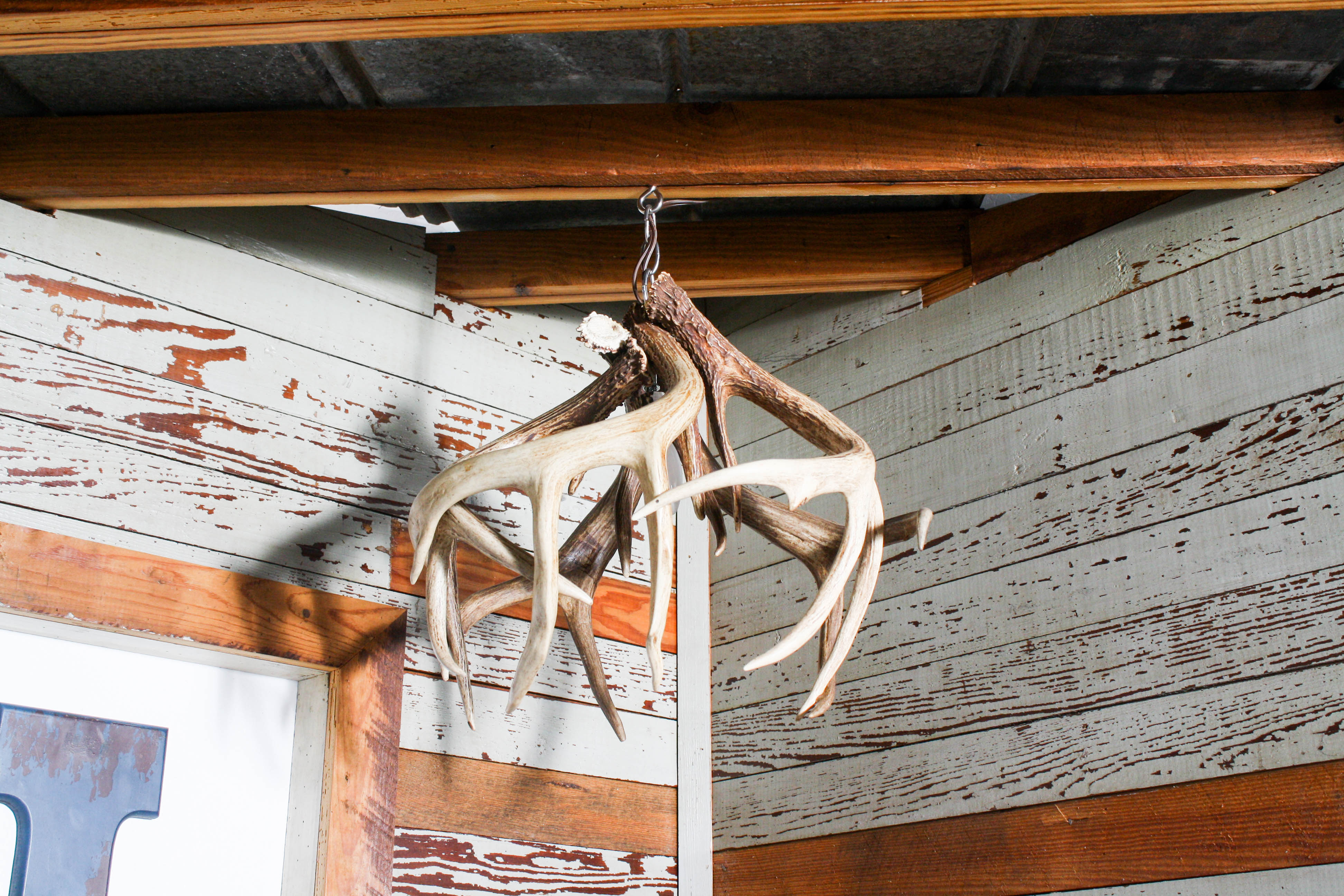 Hanging Antlers in this Rustic Hunter's Dream Nursery