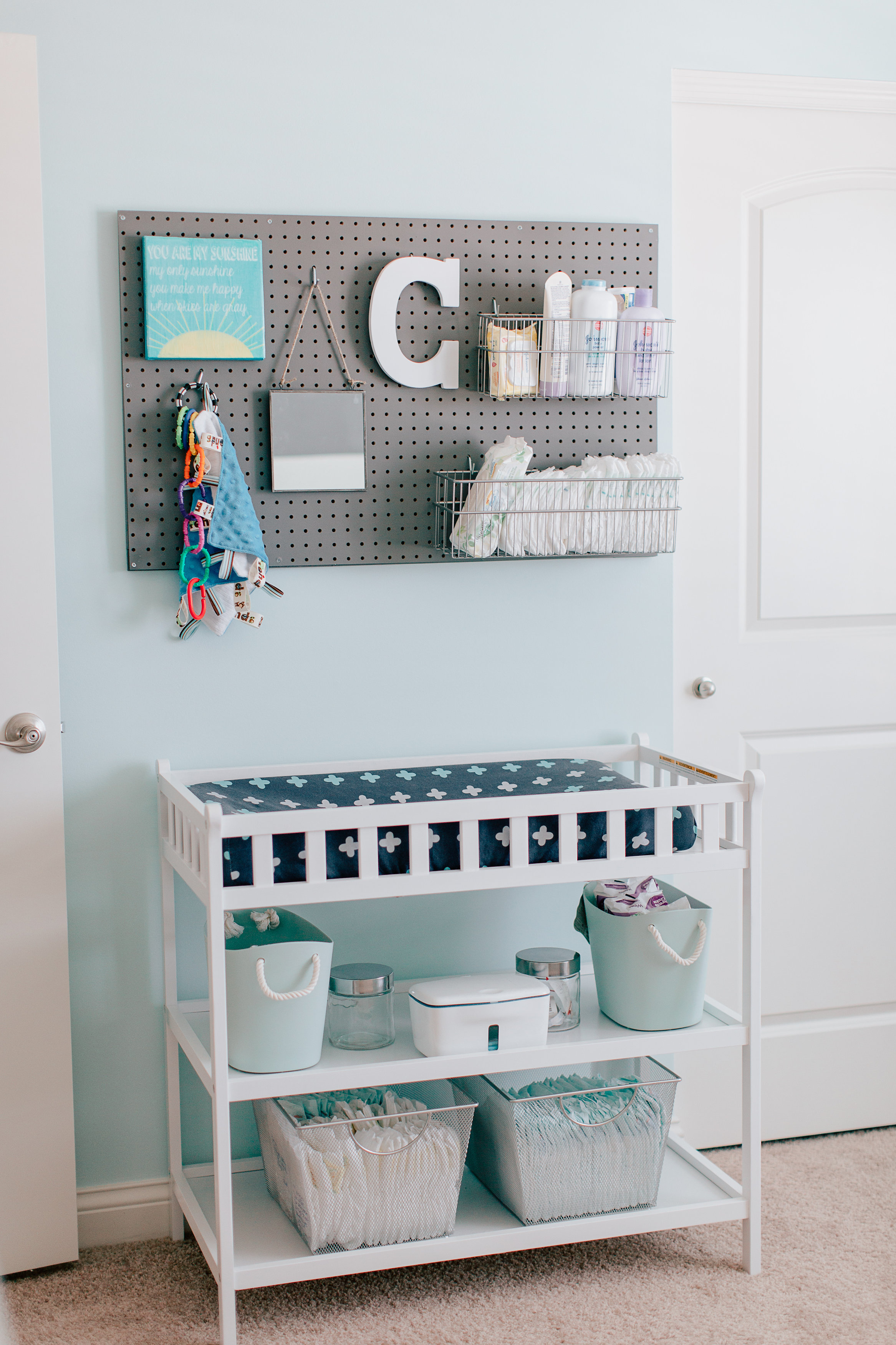 Pegboard above Changing Table for Storage