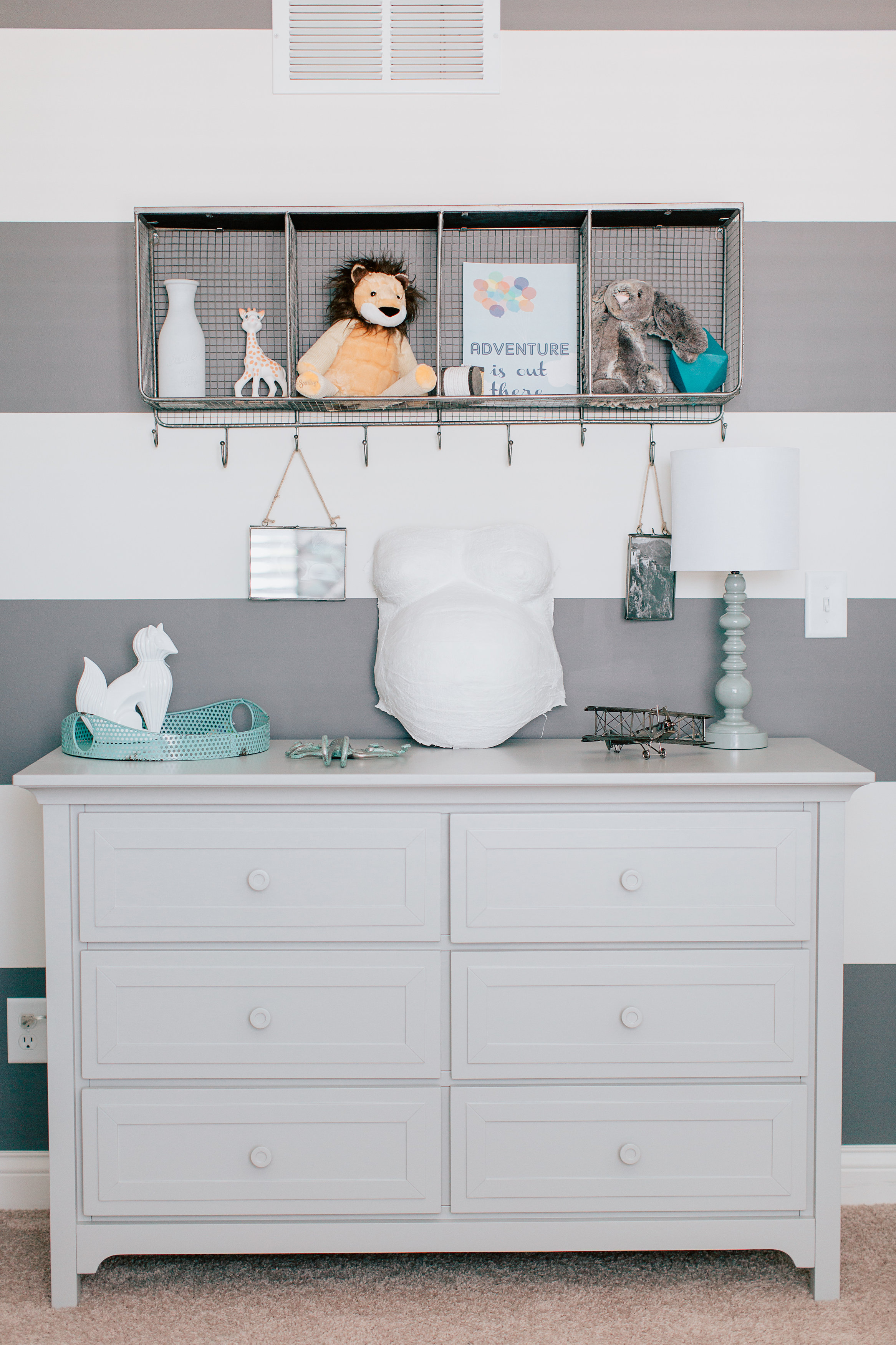 Gray and White Striped Accent Wall in this Modern Nursery