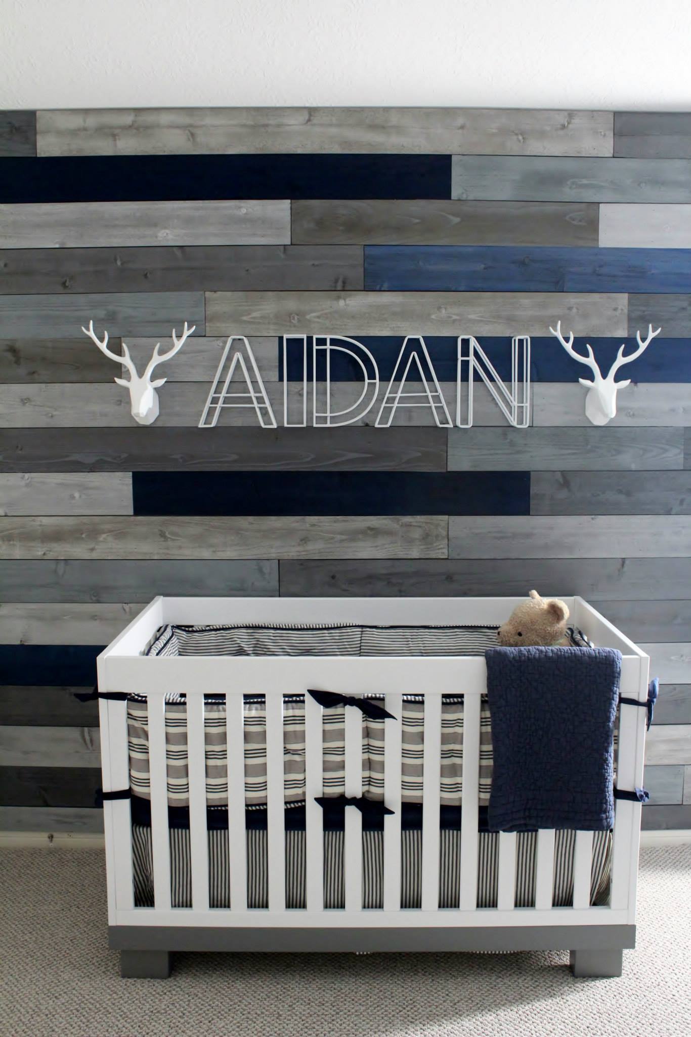 Gray and Blue Pallet Wall in this Modern Navy & Grey Rustic Nursery