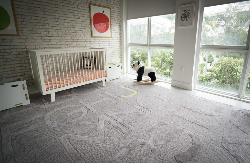 Modern and Clean Nursery with Brick Accent Wall