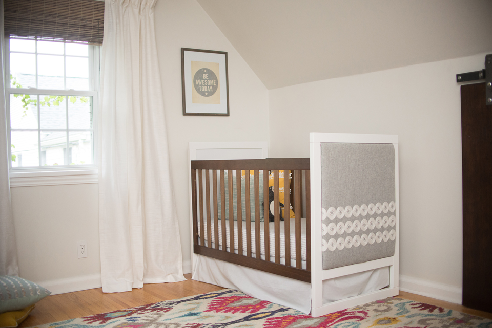 Crib with clearance upholstered headboard