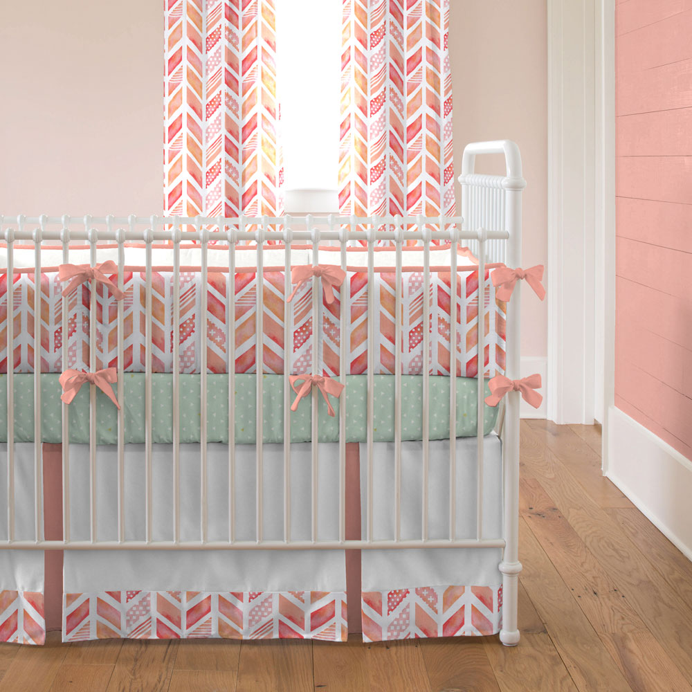 Coral Watercolor Herringbone Crib Bedding from Carousel Designs