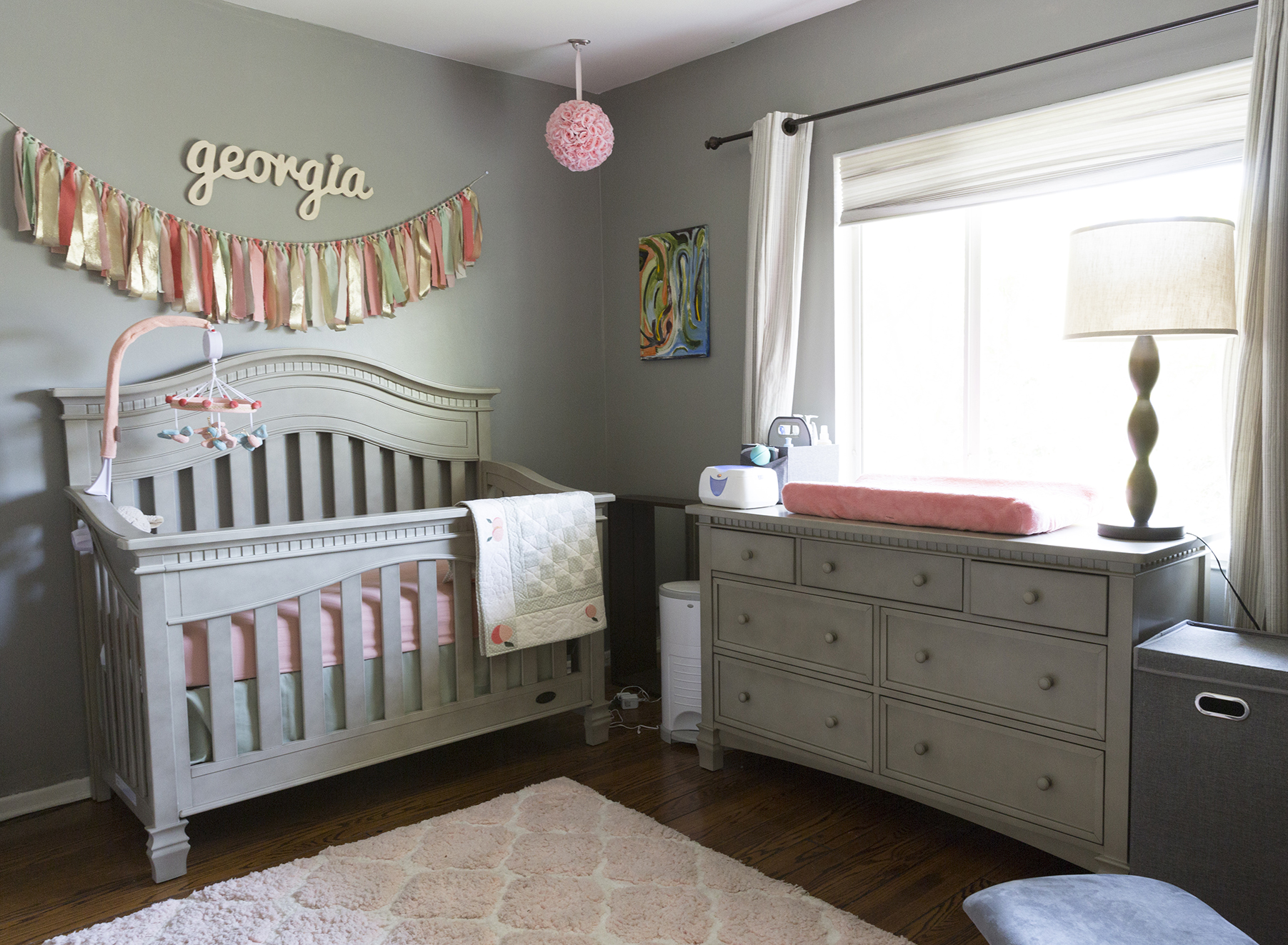 nursery with gray furniture