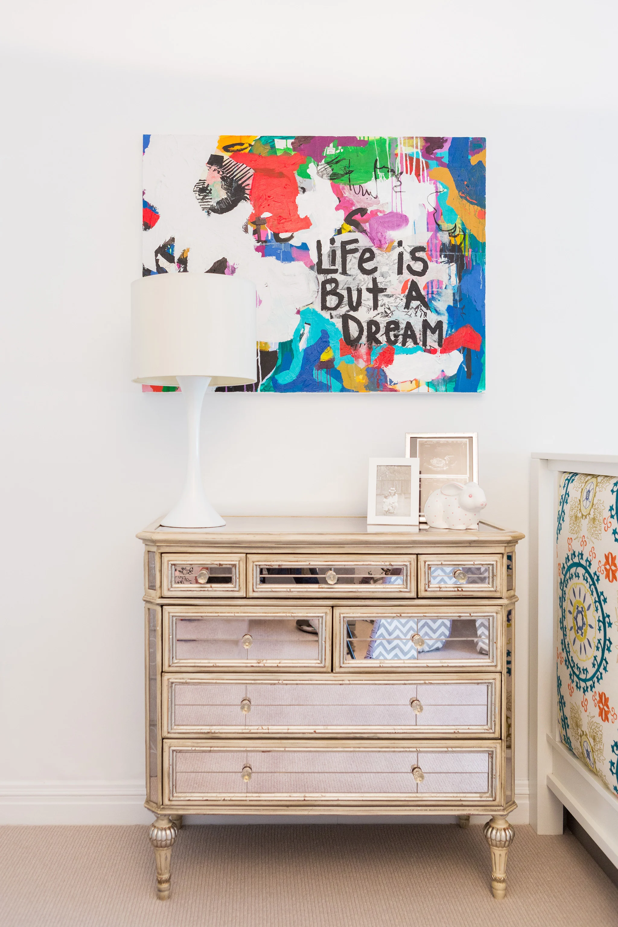 Art and Mirrored Dresser in Girl's Toddler Room 