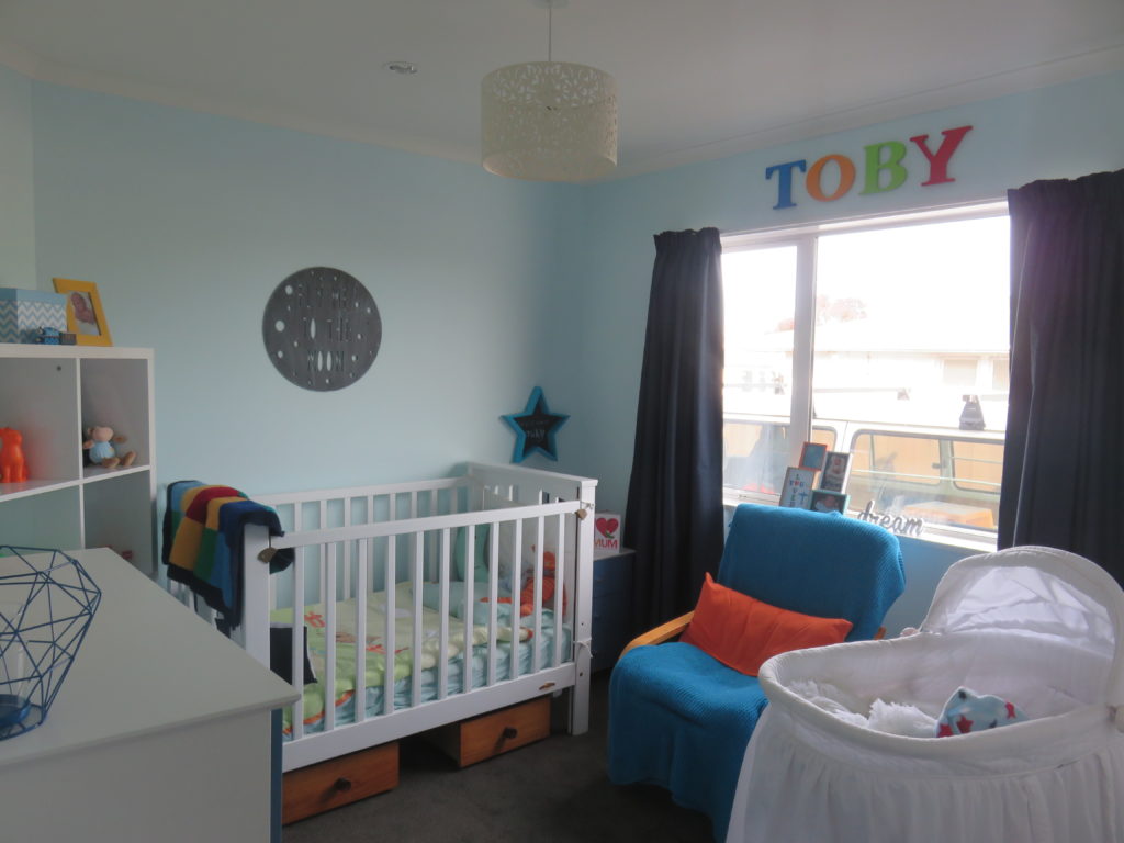 Blue Nursery with Orange and Green Accents