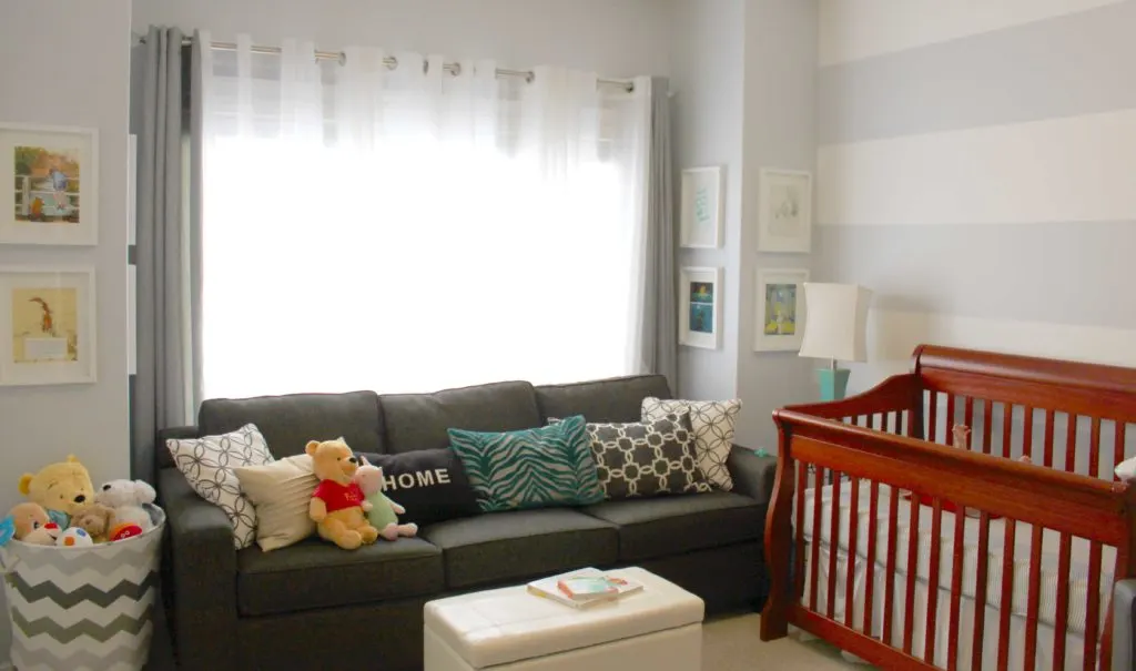 Literature Inspired Nursery with Gray Striped Accent Wall and Lounge Area - Project Nursery