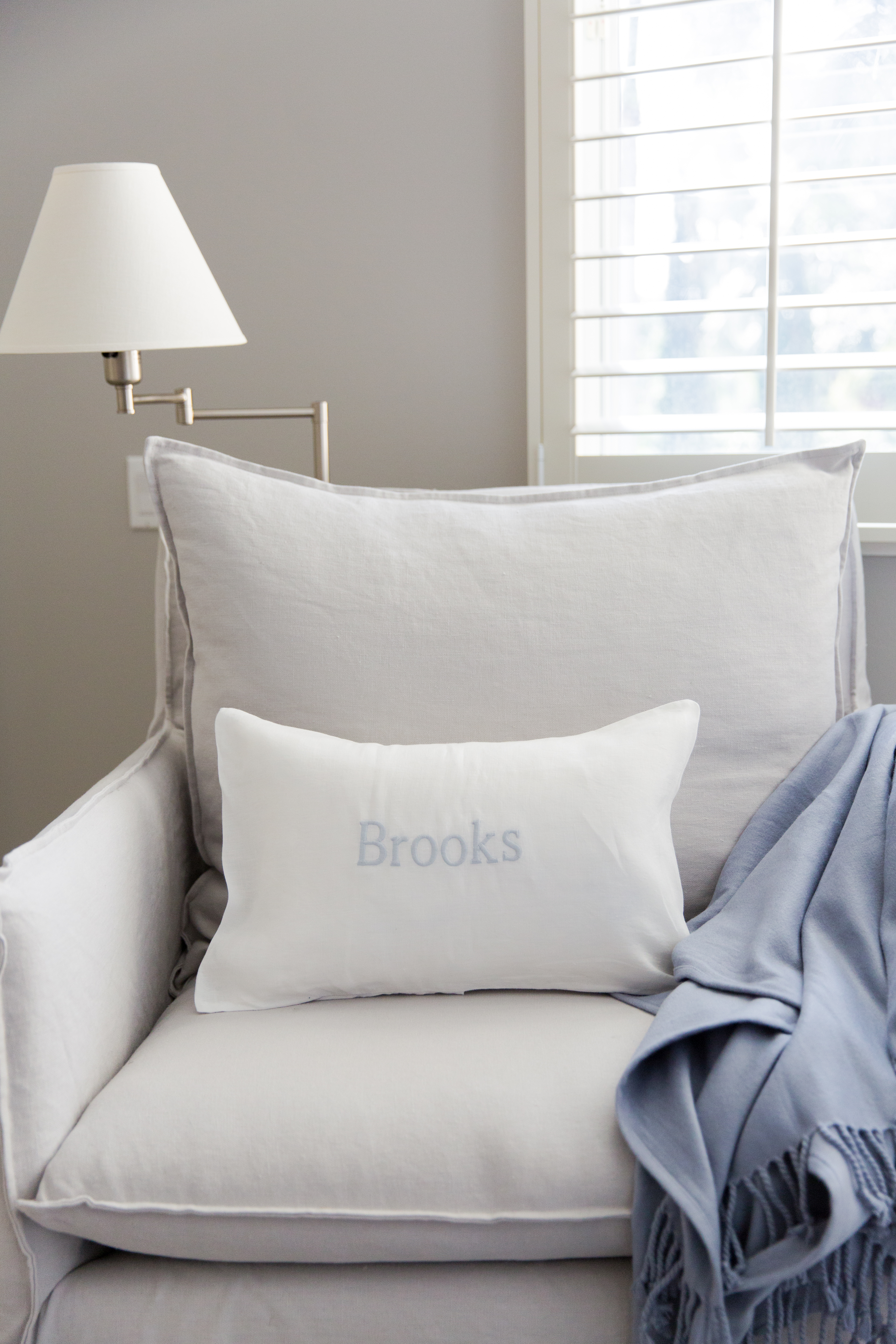 Toddler Room Reading Nook with Gray Upholstered Glider