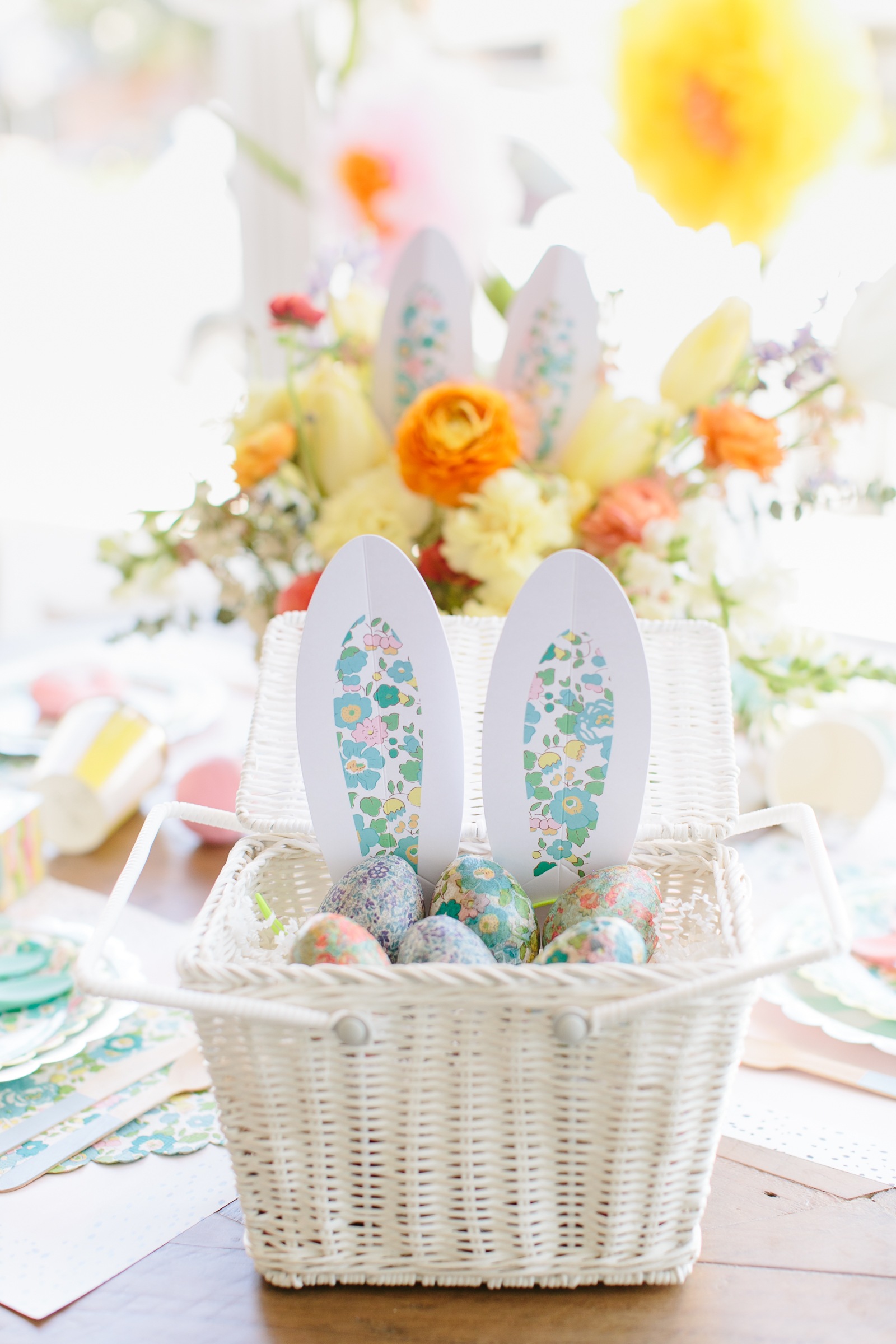 Liberty of London Papier Mâché Eggs in a white basket with bunny ears