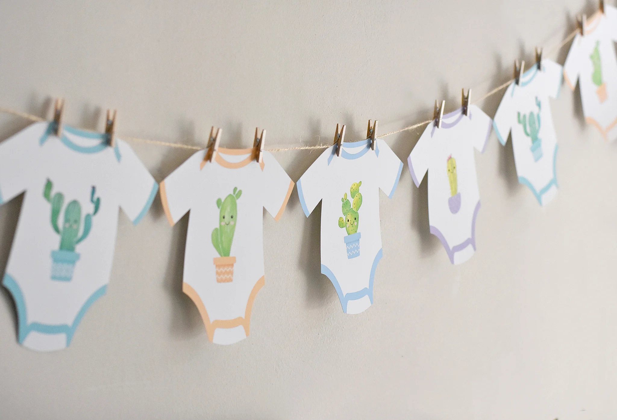 Cactus Baby Onesies on a Clothesline - Project Nursery