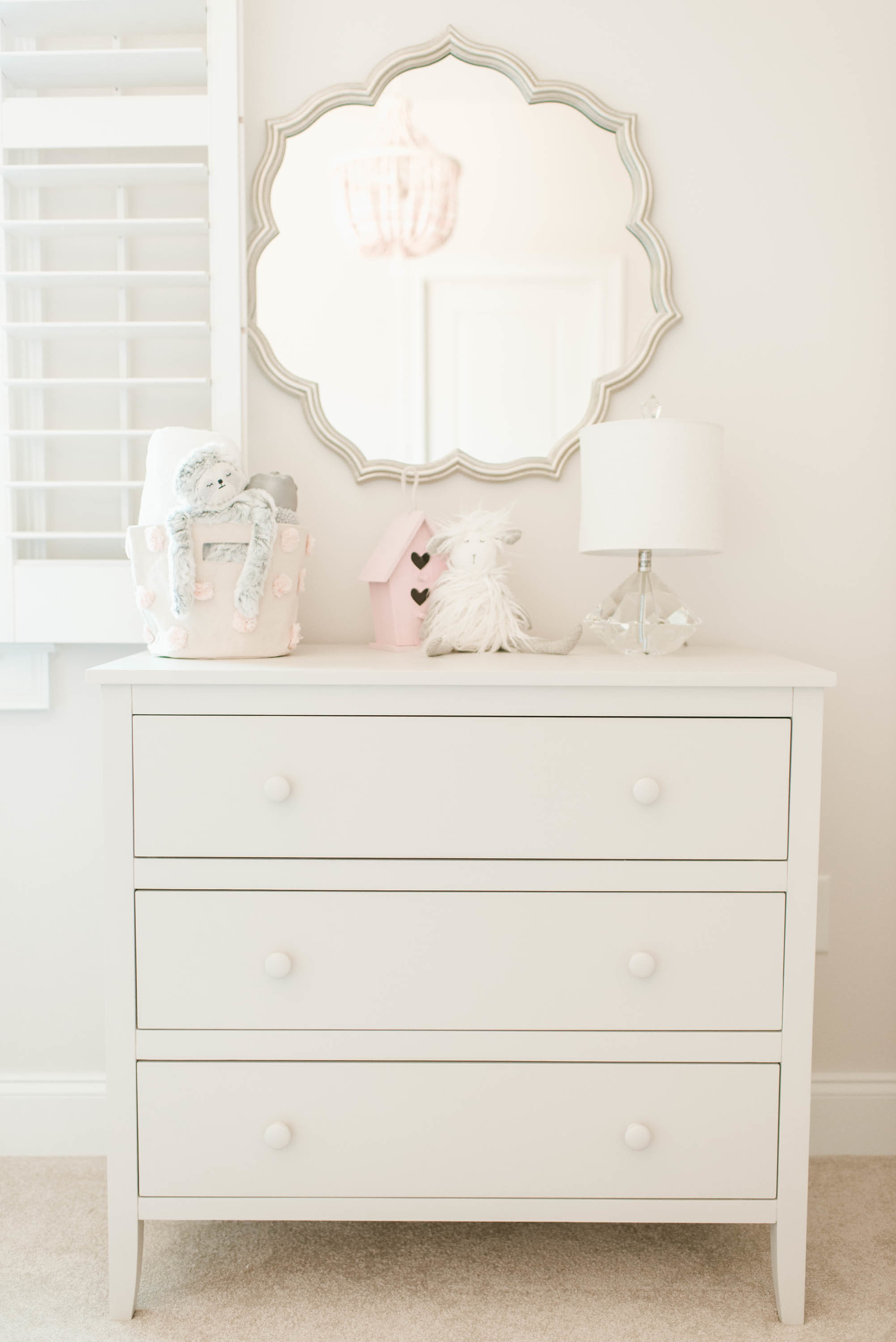 Silver Petal Mirror with White Dresser in Girl's Pink, White and Gray Nursery